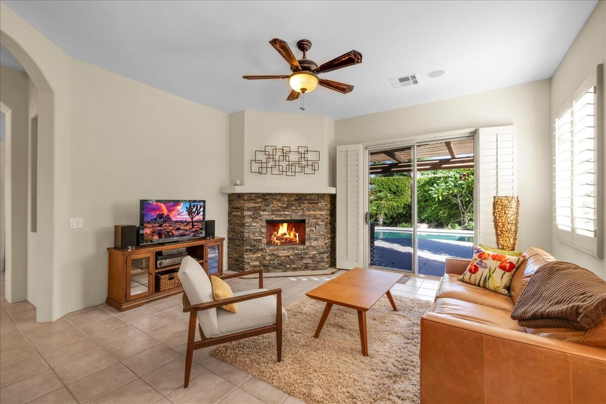 58 Payson Circle Palm Desert, CA 92211 - Photo 16 of 41 a living room with furniture and a fireplace