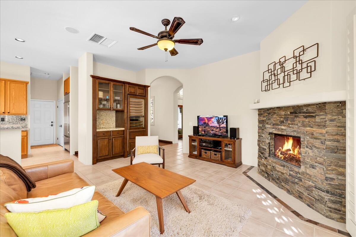 58 Payson Circle Palm Desert, CA 92211 - Photo 17 of 41 a living room with furniture a fireplace and a flat screen tv