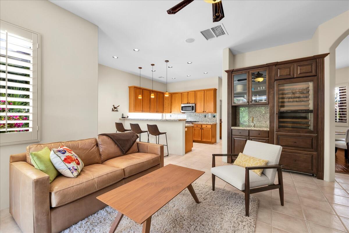 58 Payson Circle Palm Desert, CA 92211 - Photo 18 of 41 a living room with furniture and a large window