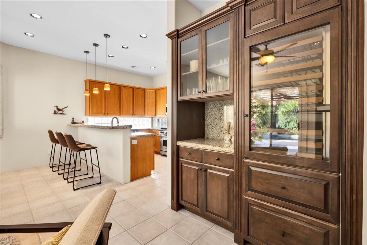 58 Payson Circle Palm Desert, CA 92211 - Photo 19 of 41 a kitchen with a refrigerator and windows