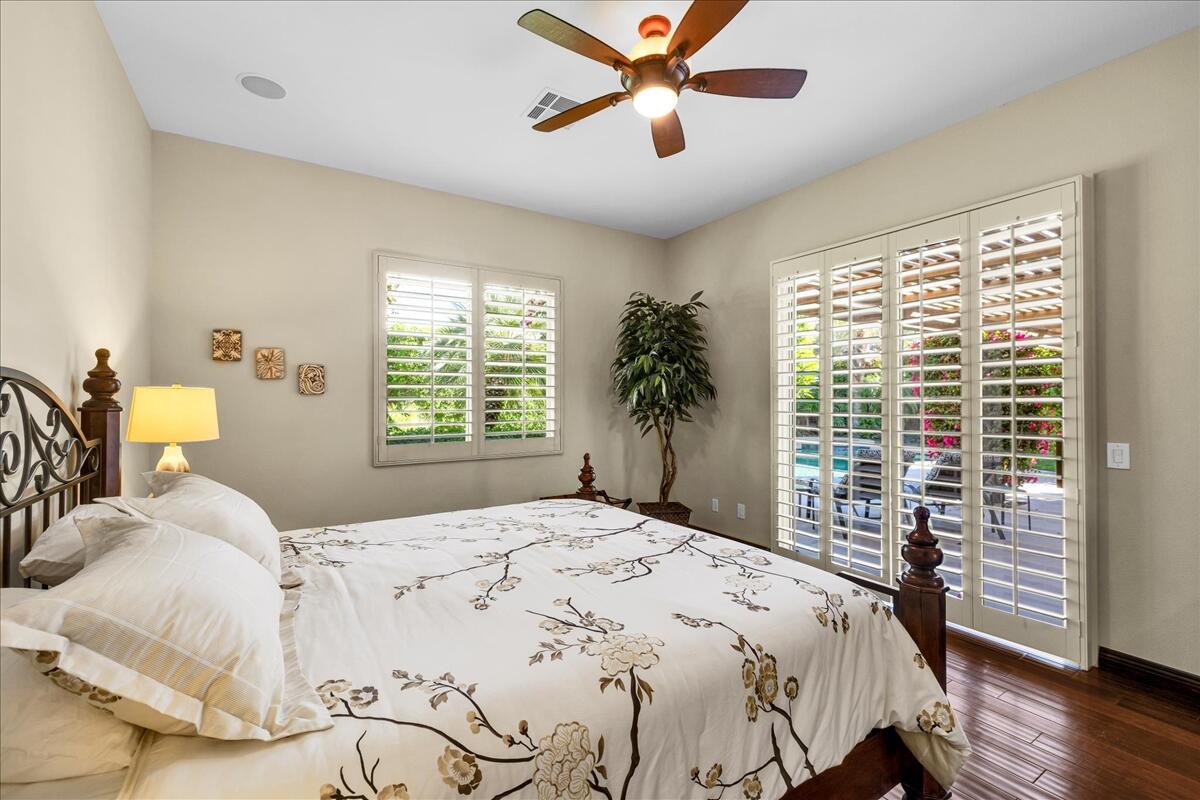 58 Payson Circle Palm Desert, CA 92211 - Photo 21 of 41 a bedroom with a large bed and a large window