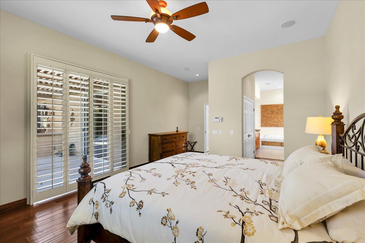 58 Payson Circle Palm Desert, CA 92211 - Photo 22 of 41 a bedroom with a large bed and a window