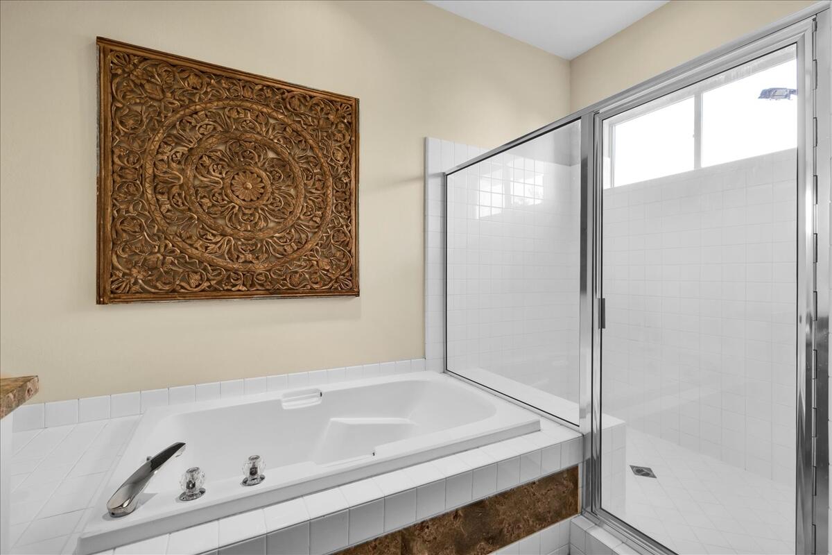 58 Payson Circle Palm Desert, CA 92211 - Photo 24 of 41 a bathroom with a tub and a shower