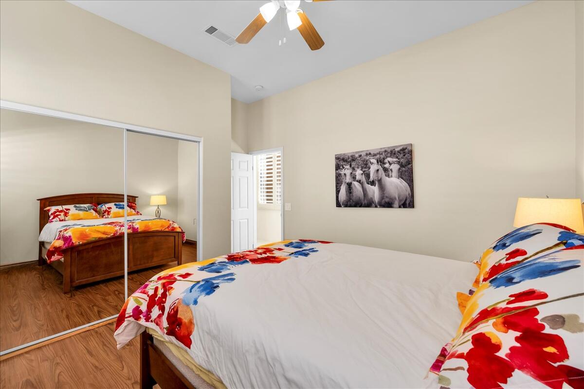 58 Payson Circle Palm Desert, CA 92211 - Photo 26 of 41 a bedroom with two beds and a lamp