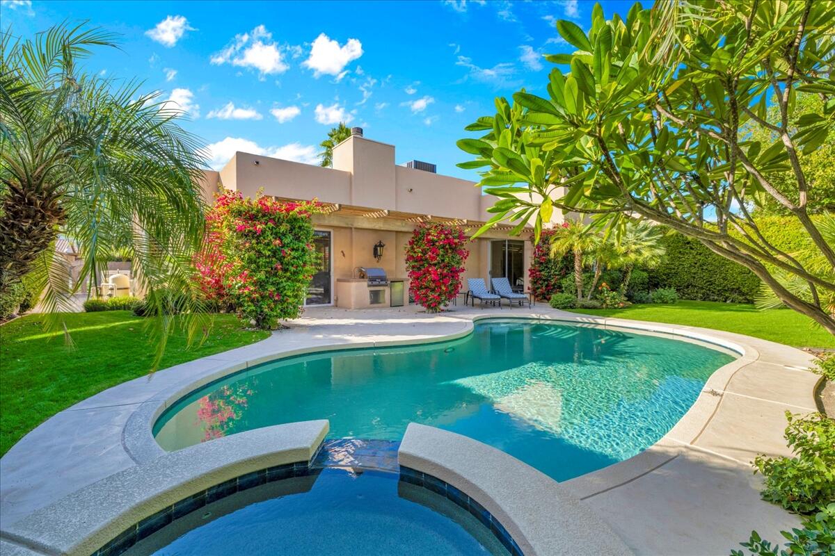 58 Payson Circle Palm Desert, CA 92211 - Photo 34 of 41 a view of a swimming pool with a patio and a yard