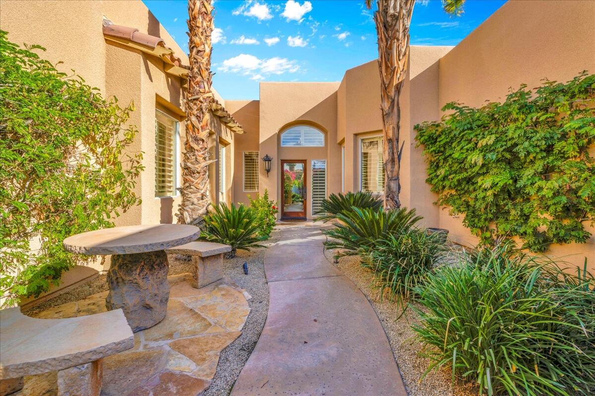 58 Payson Circle Palm Desert, CA 92211 - Photo 5 of 41 a front view of a house with garden