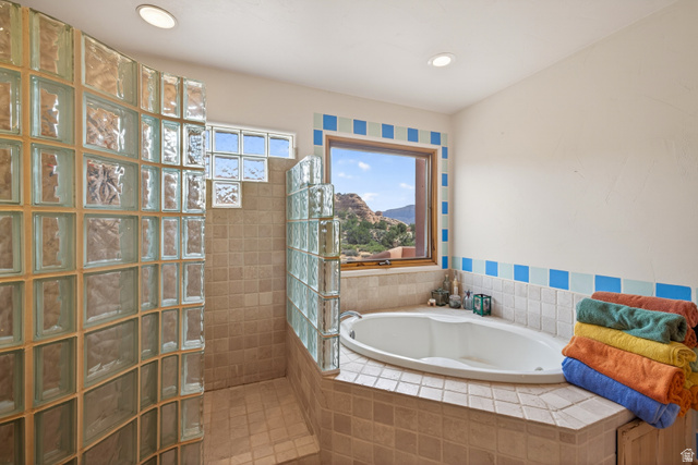 3617 Red Rock Drive Moab, UT 84532 - Photo 55 of 79 Full bathroom featuring a walk in shower, a bath, a mountain view, and recessed lighting