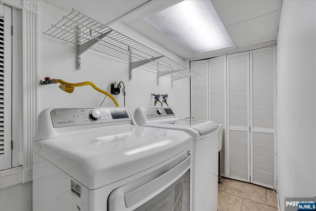 10 Irving Place Garfield, NJ 07026 - Photo 20 of 35 a utility room with dryer and washer