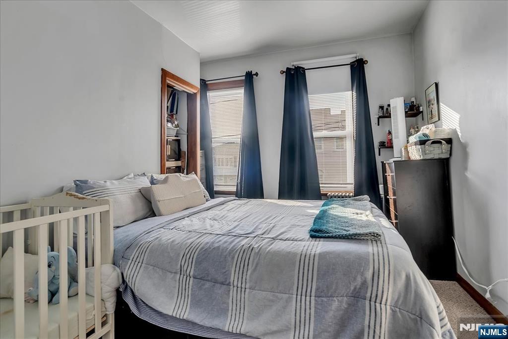 10 Irving Place Garfield, NJ 07026 - Photo 29 of 35 a bedroom with a bed and a window