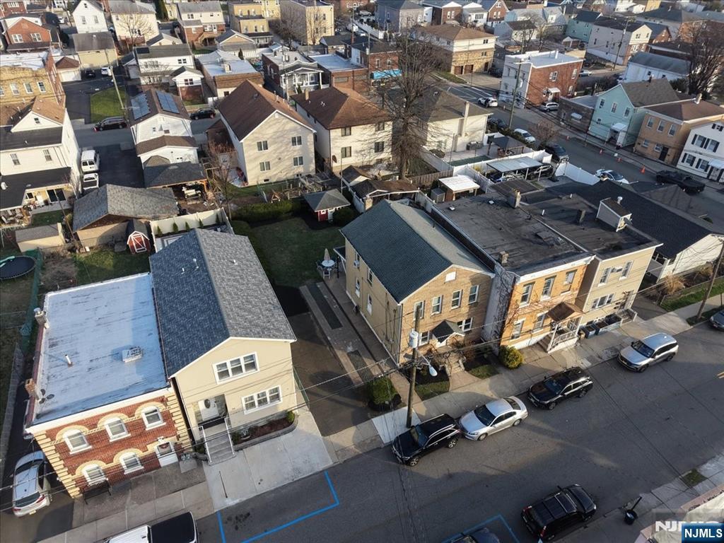 10 Irving Place Garfield, NJ 07026 - Photo 34 of 35 an aerial view of a residential apartment building with parking