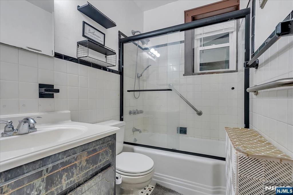 10 Irving Place Garfield, NJ 07026 - Photo 10 of 35 a bathroom with a sink toilet and shower