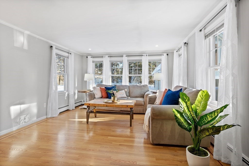 111 Groton School Road Ayer, MA 01432 - Photo 3 of 41 a living room with furniture potted plant and a large window