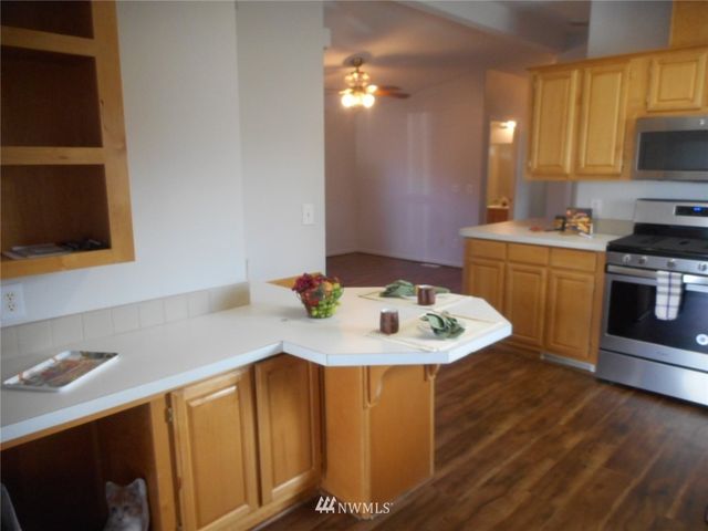 a white kitchen with a sink and a stove