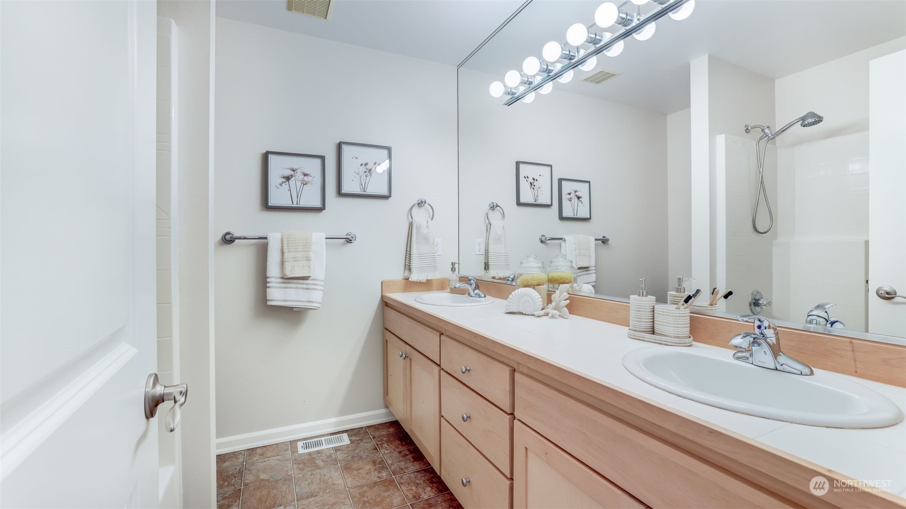 20622 Southeast 162nd Way Renton, WA 98059 - Photo 18 of 27 a spacious bathroom with a double vanity sink a mirror and shower