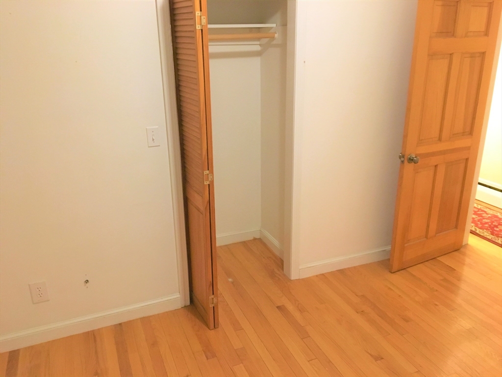 391 Langley Road, Unit 2 Newton, MA 02459 - Photo 8 of 12 a view of an empty room