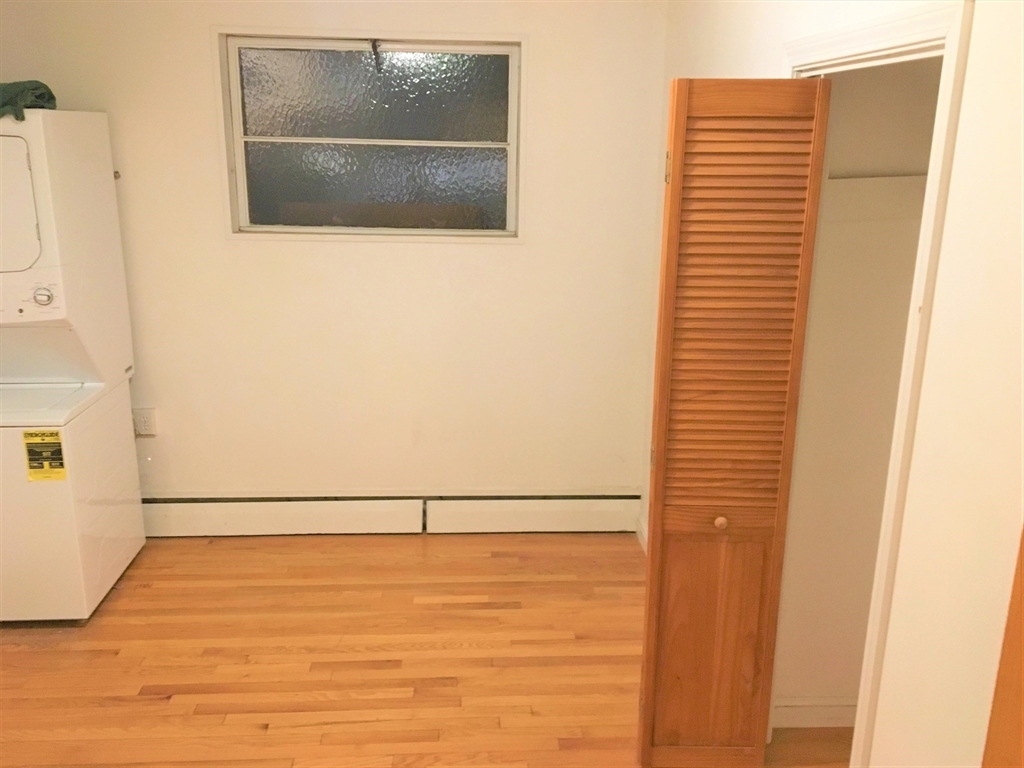 391 Langley Road, Unit 2 Newton, MA 02459 - Photo 9 of 12 a view of water heater room