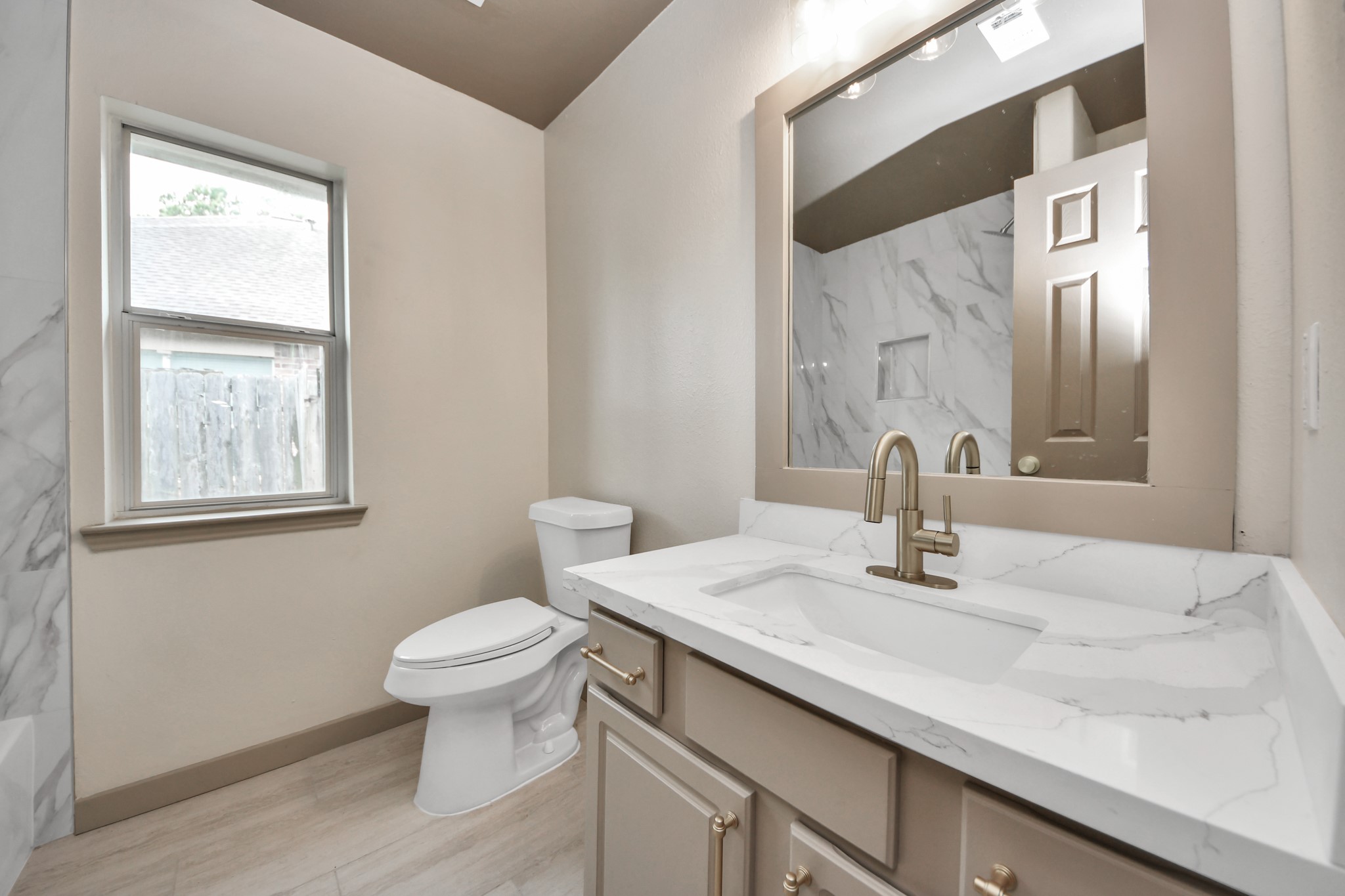 14423 Gadwall Court Houston, TX 77044 - Photo 15 of 42 a bathroom with a sink and a toilet