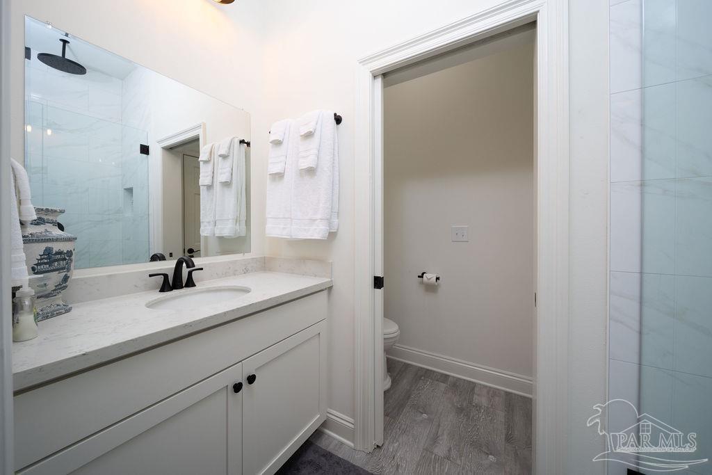 714 East La Rua Street Pensacola, FL 32501 - Photo 23 of 63 a bathroom with a granite countertop sink and a mirror