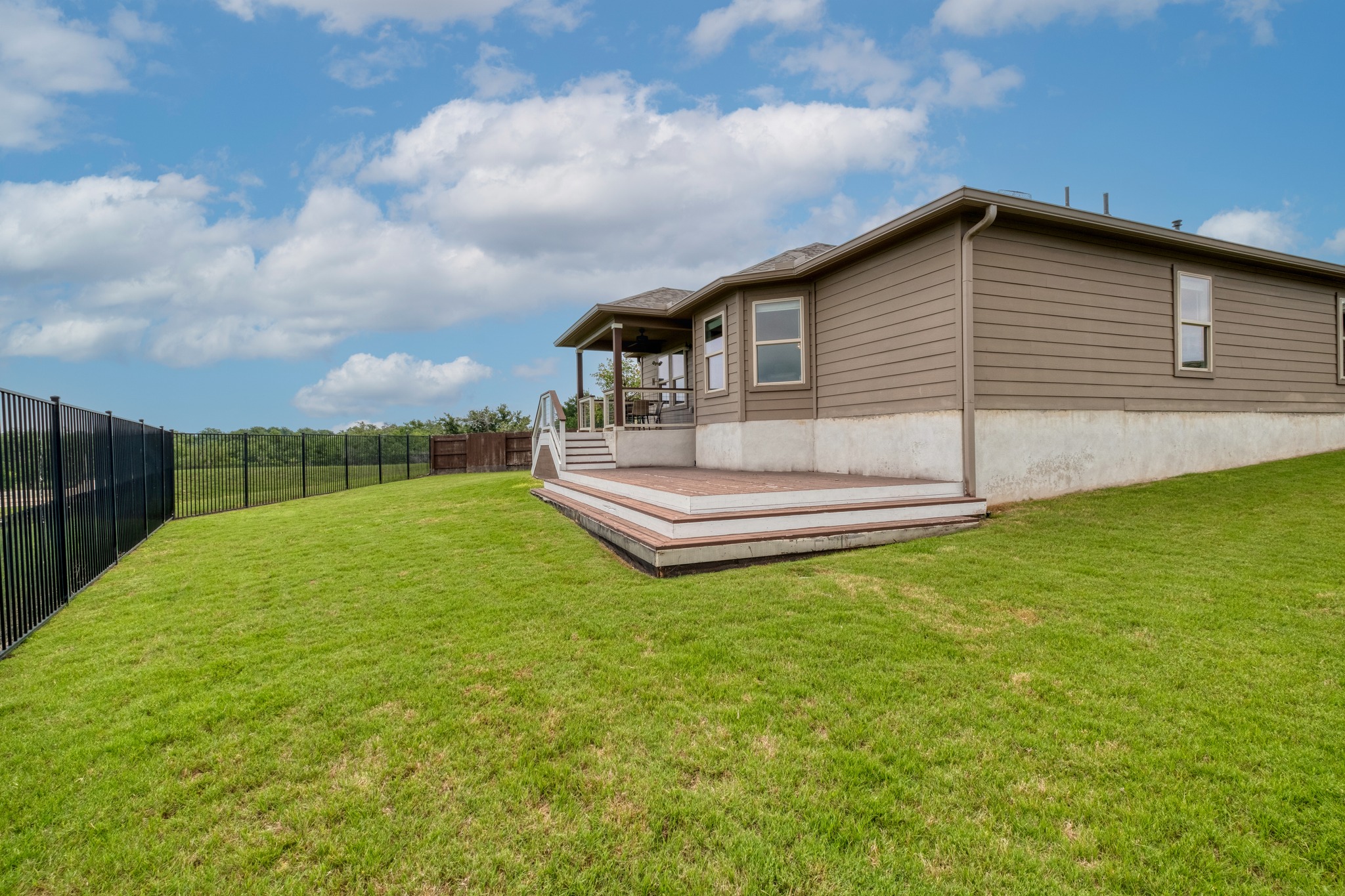 1000 Bright Star Cove Georgetown, TX 78628 - Photo 5 of 40 a view of a house with a backyard