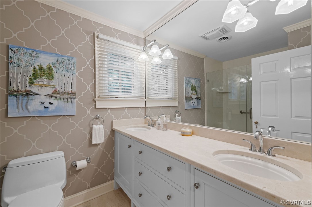 3981 Reeds Landing Circle Midlothian, VA 23113 - Photo 38 of 49 a bathroom with a double vanity sink and a mirror