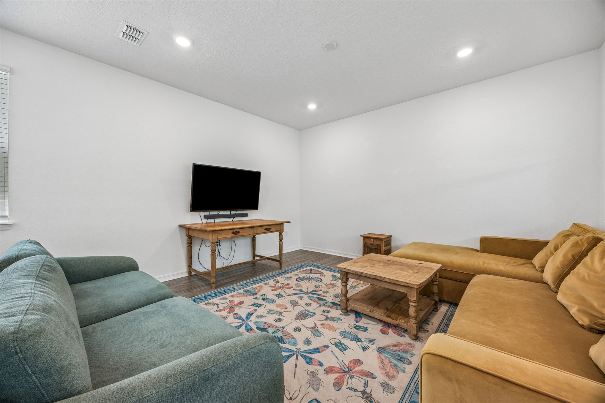 236 Hawthorn Park Circle Yulee, FL 32097 - Photo 10 of 28 a living room with furniture and a flat screen tv