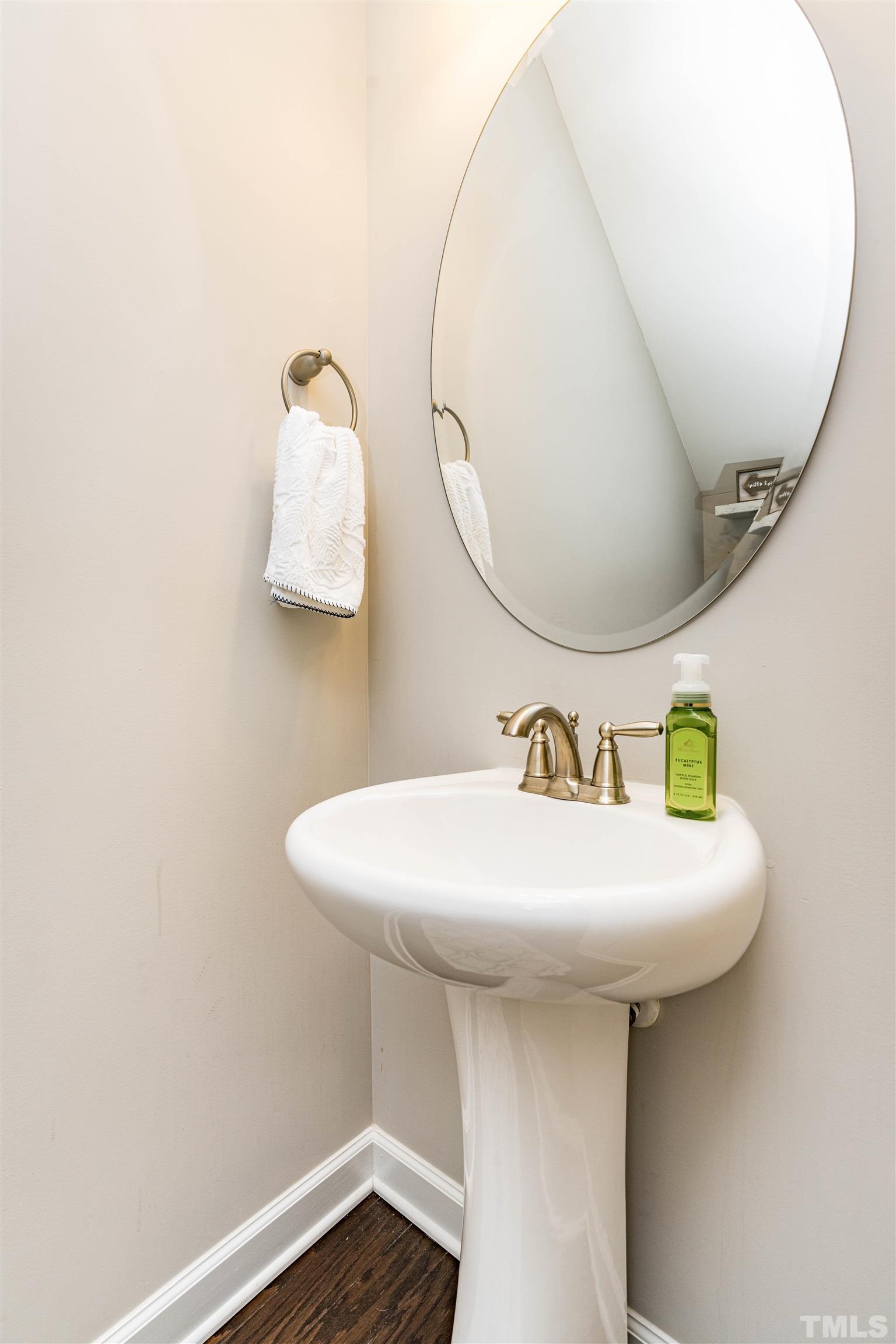 11565 Barnes Road Middlesex, NC 27557 - Photo 18 of 25 a bathroom with a sink and mirror