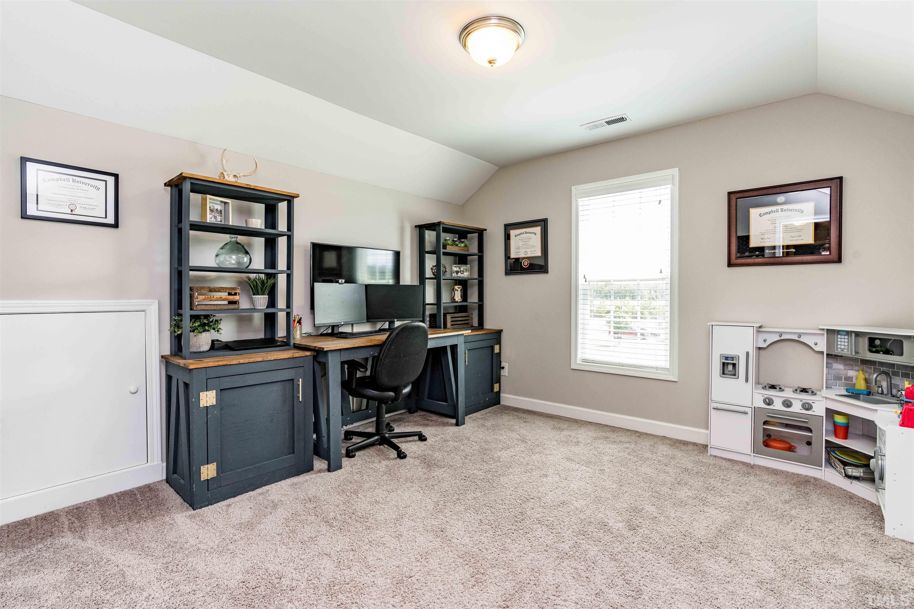 11565 Barnes Road Middlesex, NC 27557 - Photo 19 of 25 a view of a workspace with furniture and a window