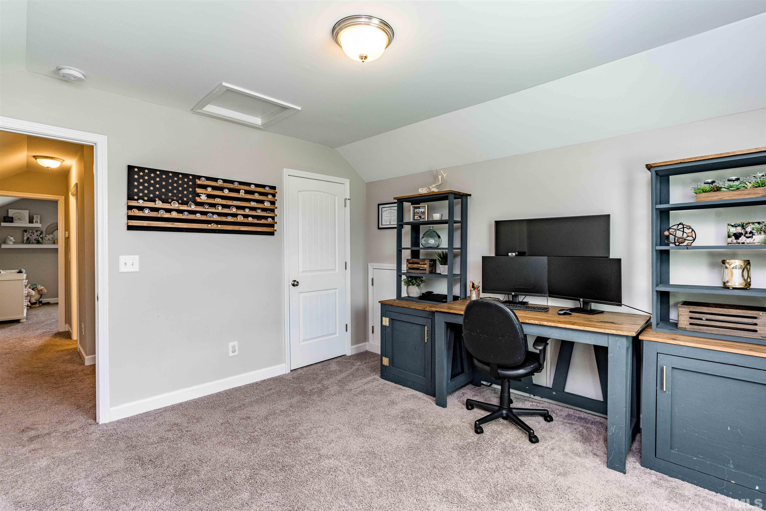 11565 Barnes Road Middlesex, NC 27557 - Photo 20 of 25 a view of a workspace with furniture and a window