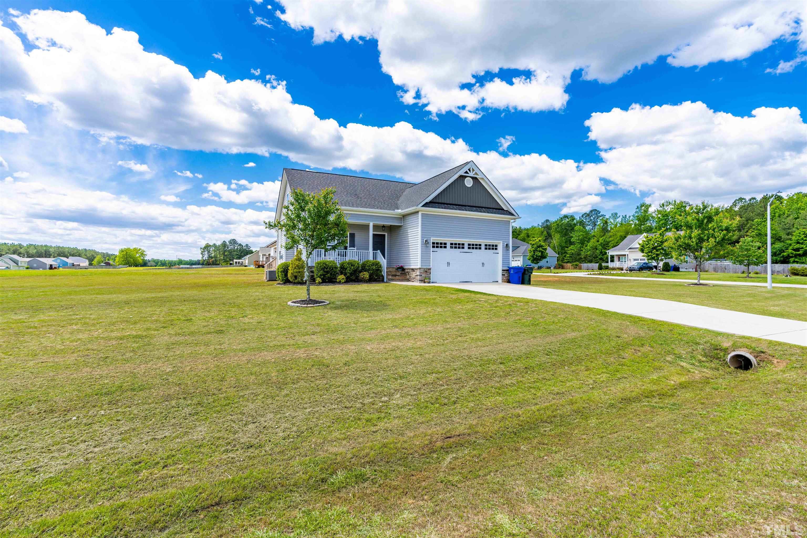 11565 Barnes Road Middlesex, NC 27557 - Photo 2 of 25 a view of an house with pool and a yard