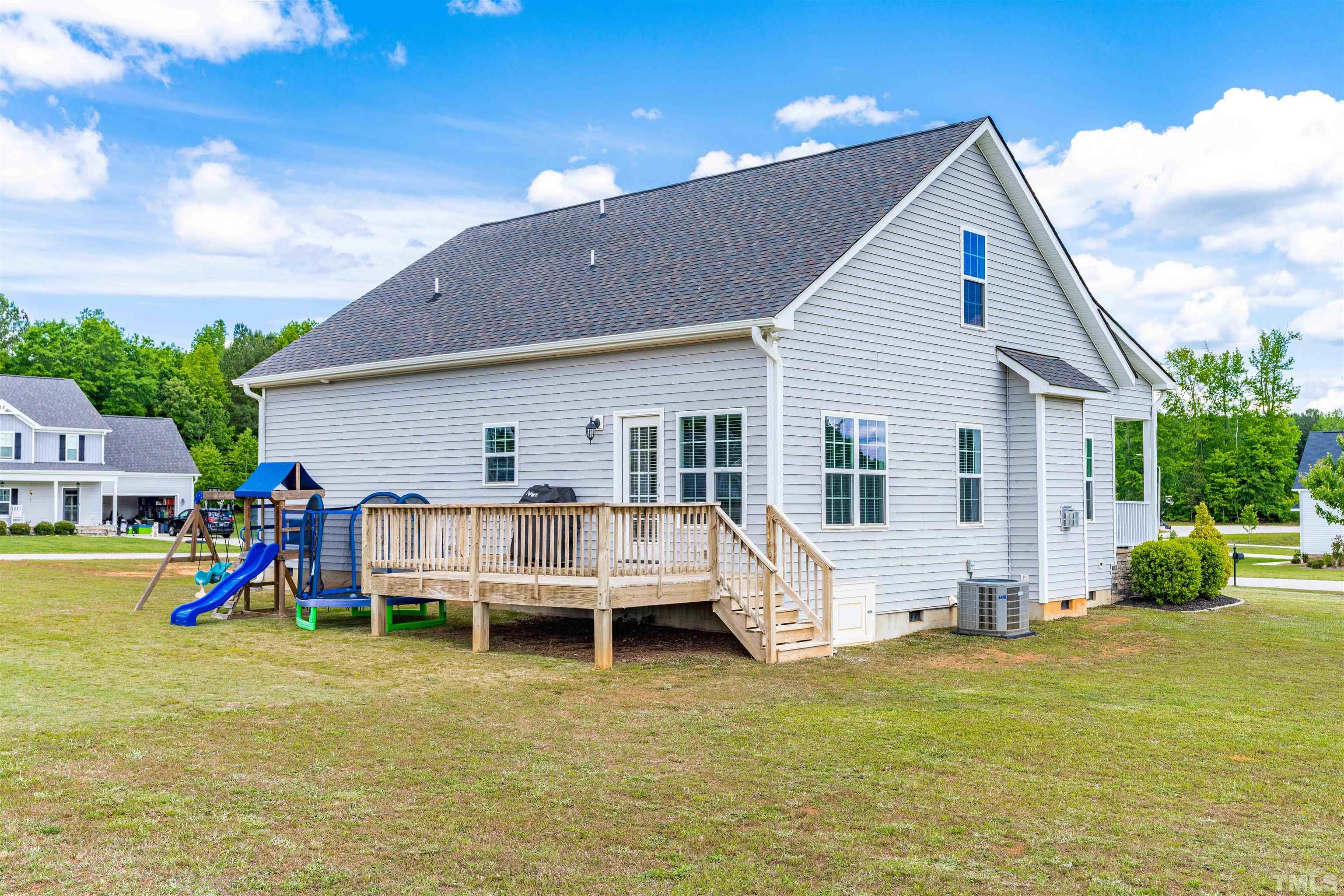 11565 Barnes Road Middlesex, NC 27557 - Photo 24 of 25 a view of a house with backyard porch and sitting area