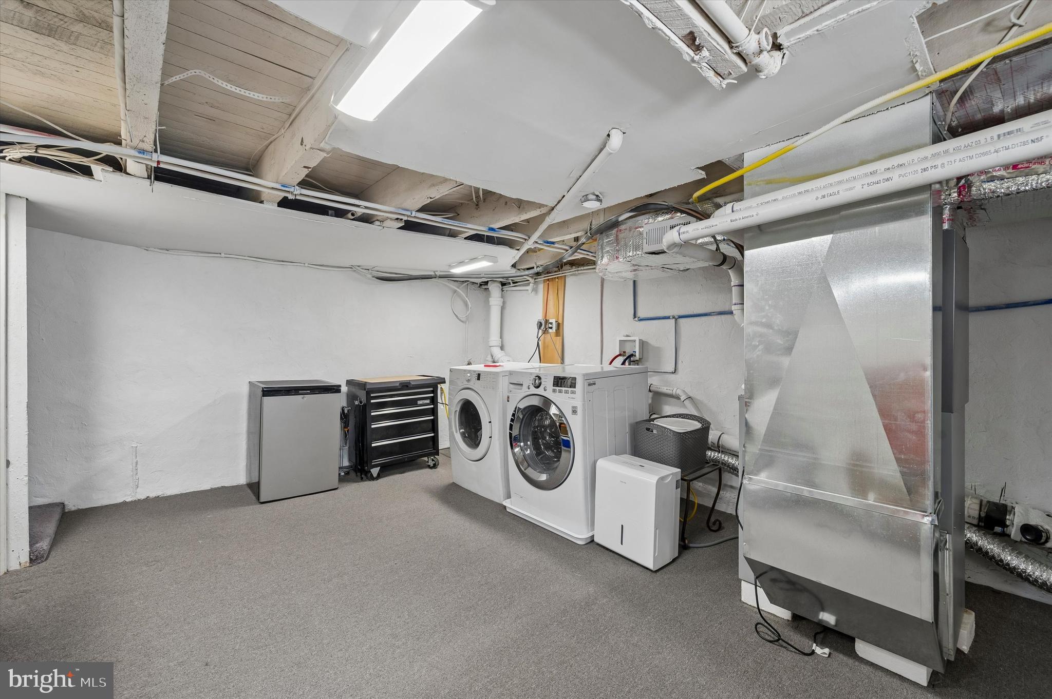 4509 Ritchie Street Philadelphia, PA 19127 - Photo 14 of 16 a utility room with dryer washer and stair