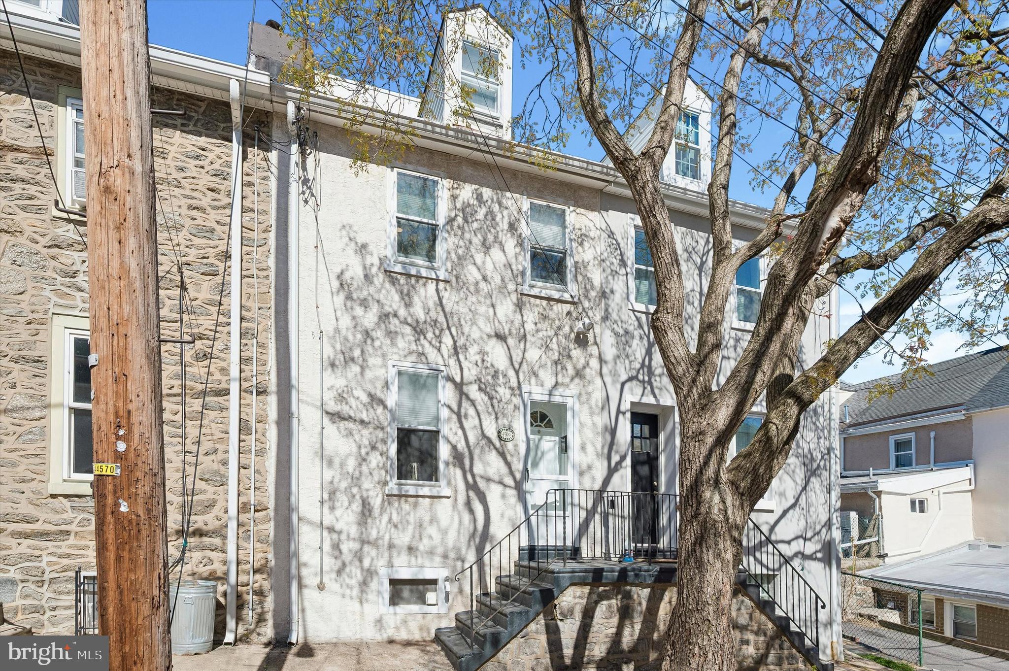 4509 Ritchie Street Philadelphia, PA 19127 - Photo 16 of 16 a view of a large building with a tree