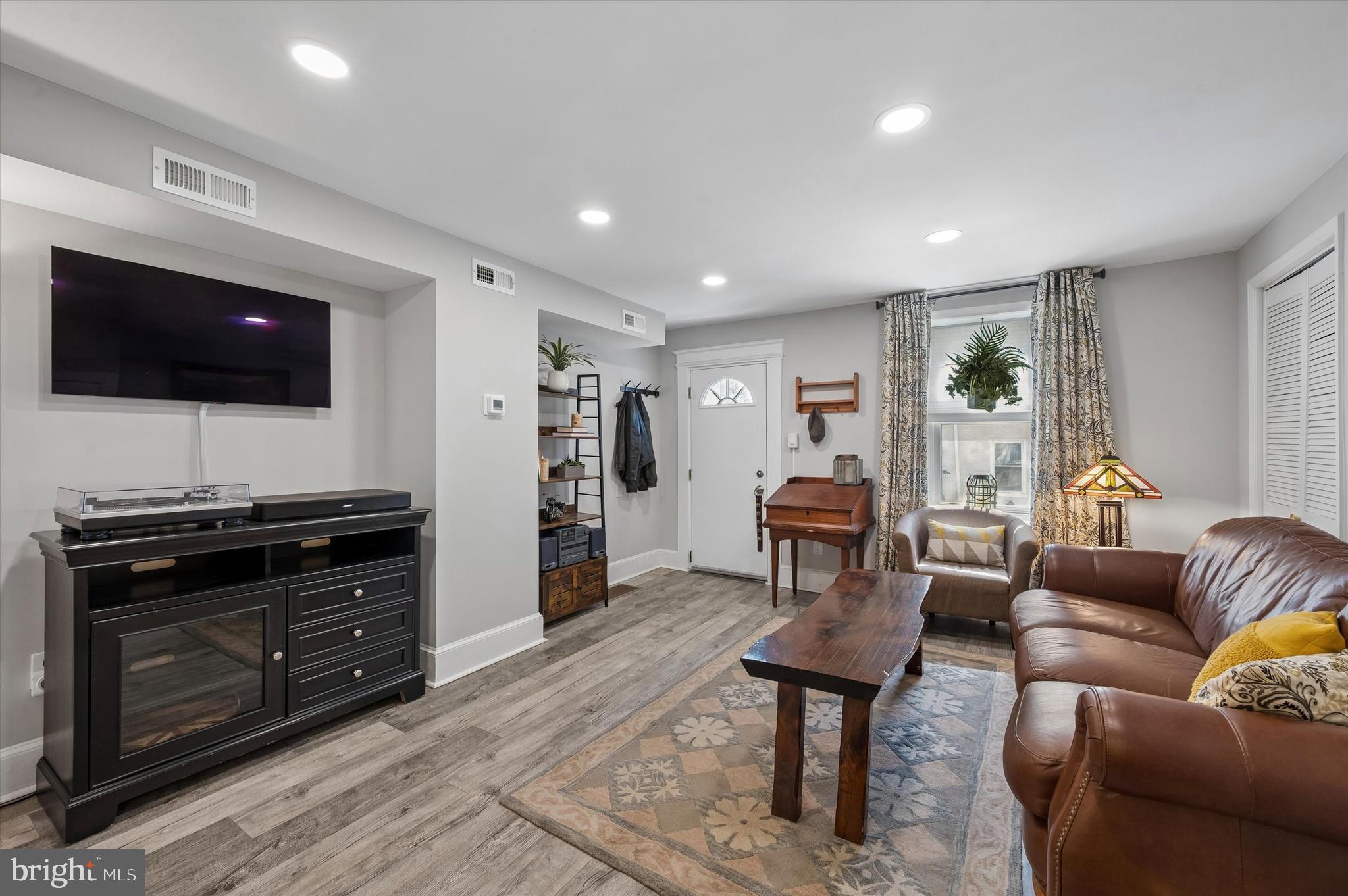 4509 Ritchie Street Philadelphia, PA 19127 - Photo 3 of 16 a living room with furniture and a flat screen tv