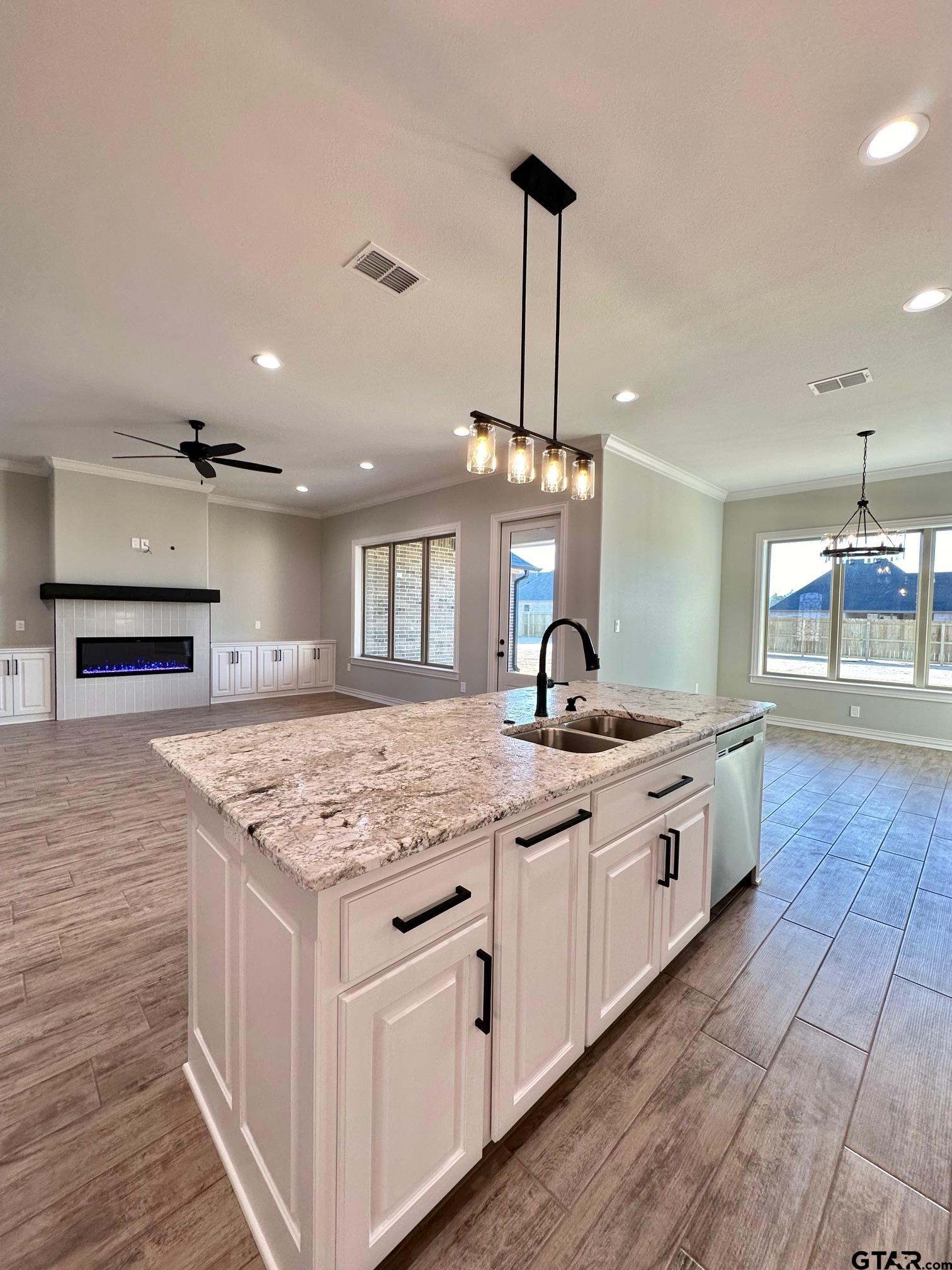 191 Brooks Drive Gladewater, TX 75647 - Photo 18 of 45 a kitchen with stainless steel appliances granite countertop a sink and a stove