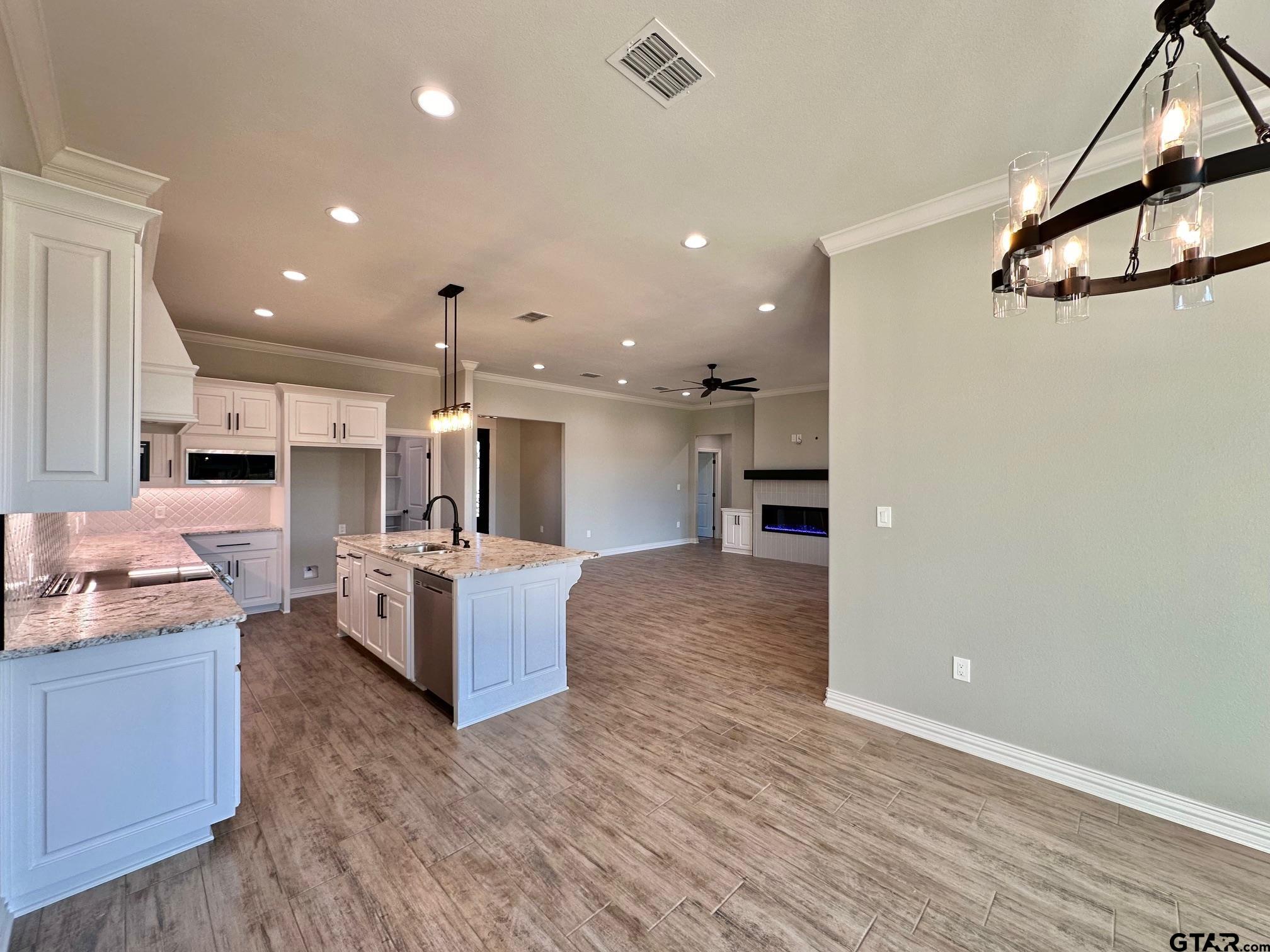 191 Brooks Drive Gladewater, TX 75647 - Photo 19 of 45 a large white kitchen with a large counter top appliances and cabinets