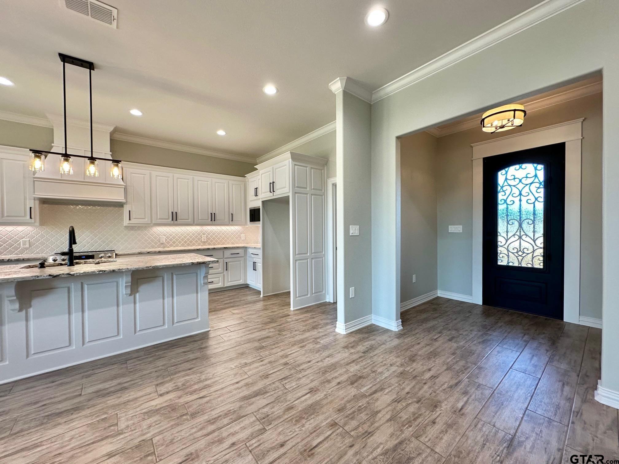 191 Brooks Drive Gladewater, TX 75647 - Photo 20 of 45 a large kitchen with stainless steel appliances granite countertop a stove and a sink with granite countertops