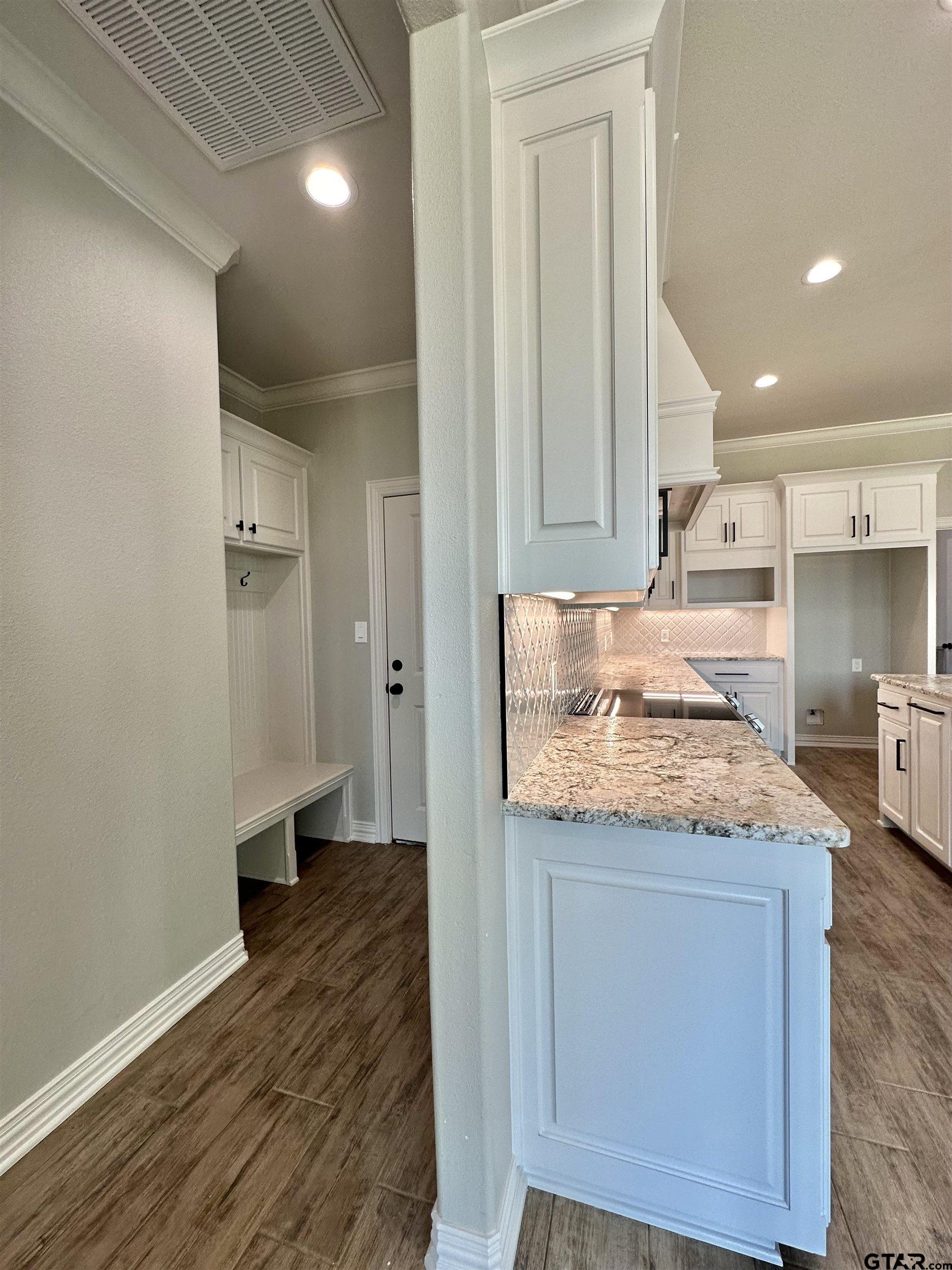 191 Brooks Drive Gladewater, TX 75647 - Photo 22 of 45 a kitchen with kitchen island a counter top space and a sink