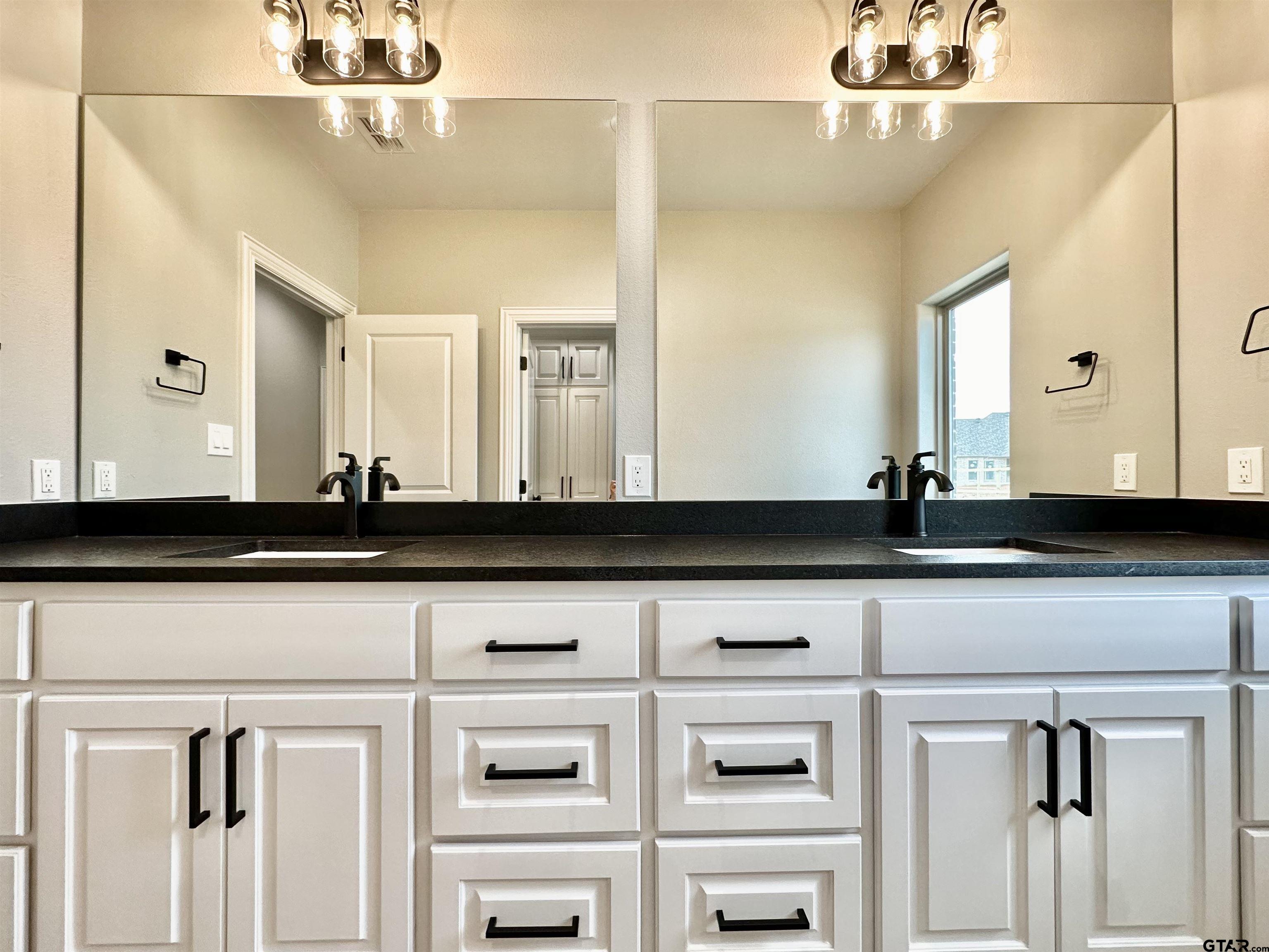 191 Brooks Drive Gladewater, TX 75647 - Photo 37 of 45 a bathroom with a sink and a mirror