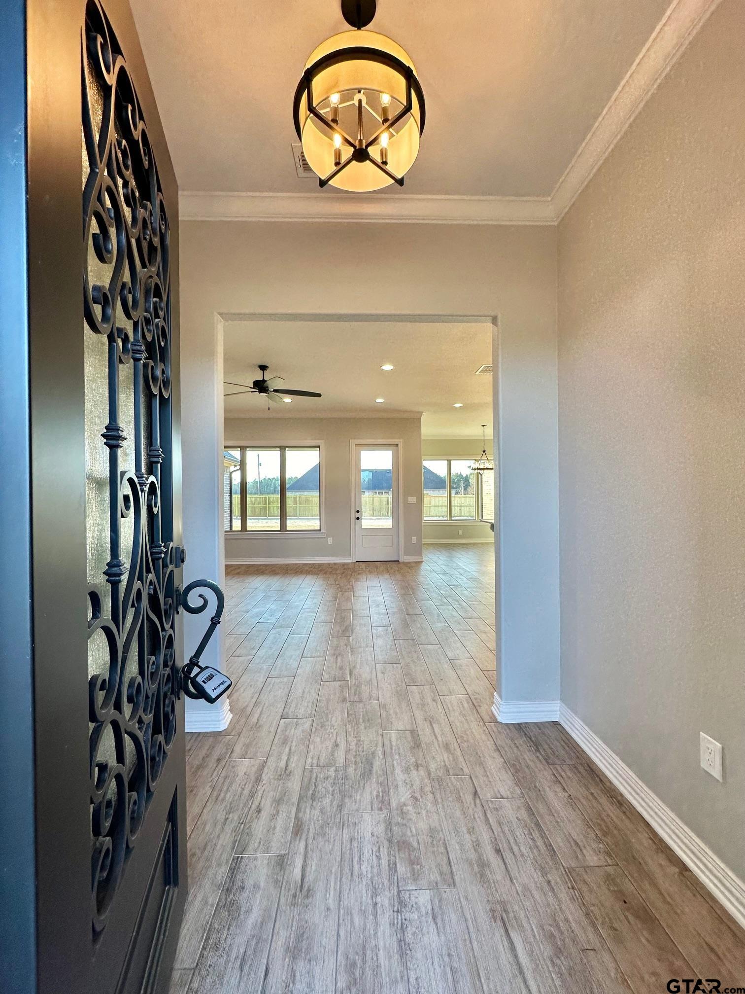 191 Brooks Drive Gladewater, TX 75647 - Photo 5 of 45 a view of an entryway with wooden floor