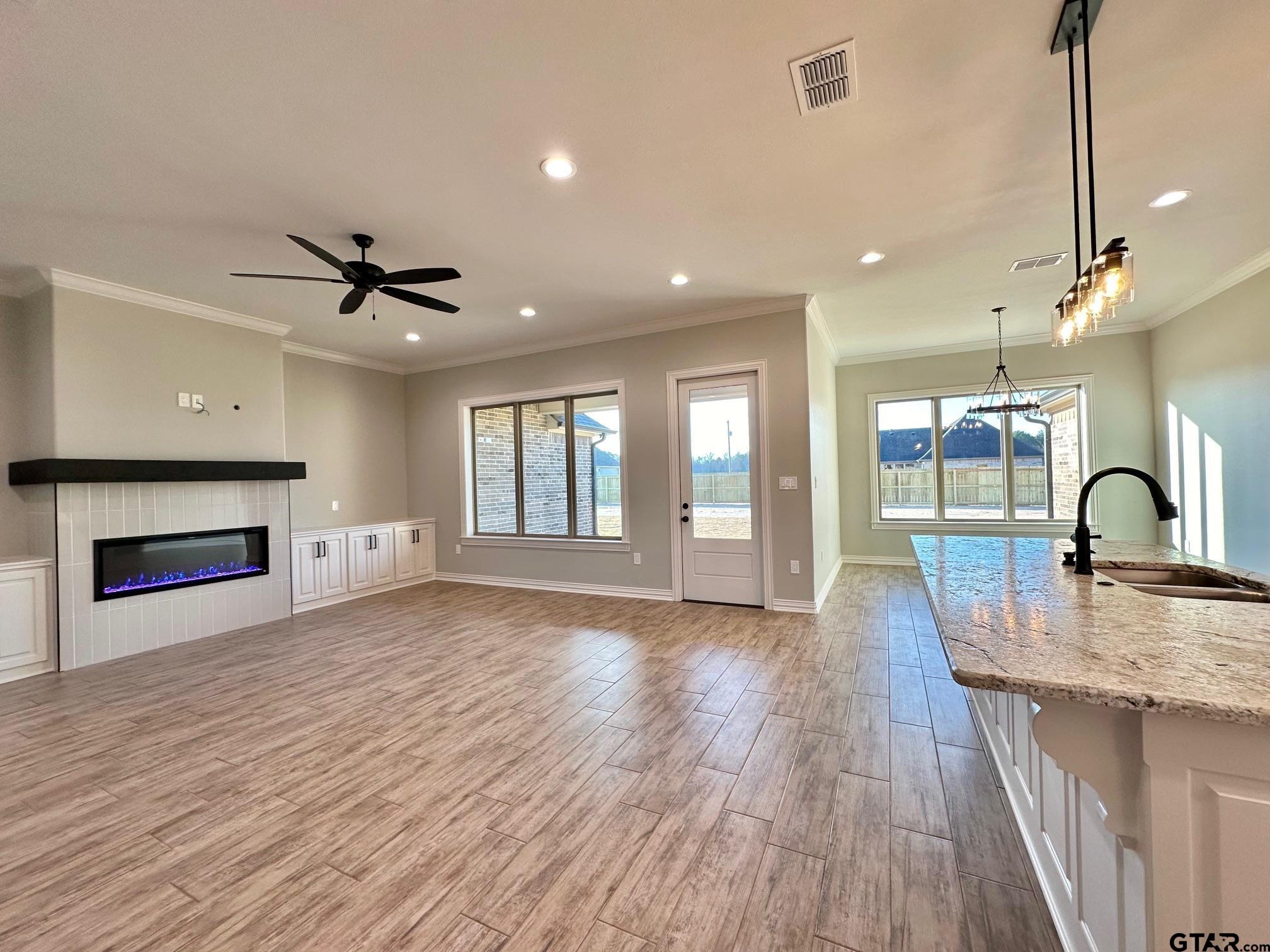 191 Brooks Drive Gladewater, TX 75647 - Photo 8 of 45 a view of a kitchen with a sink and a fireplace