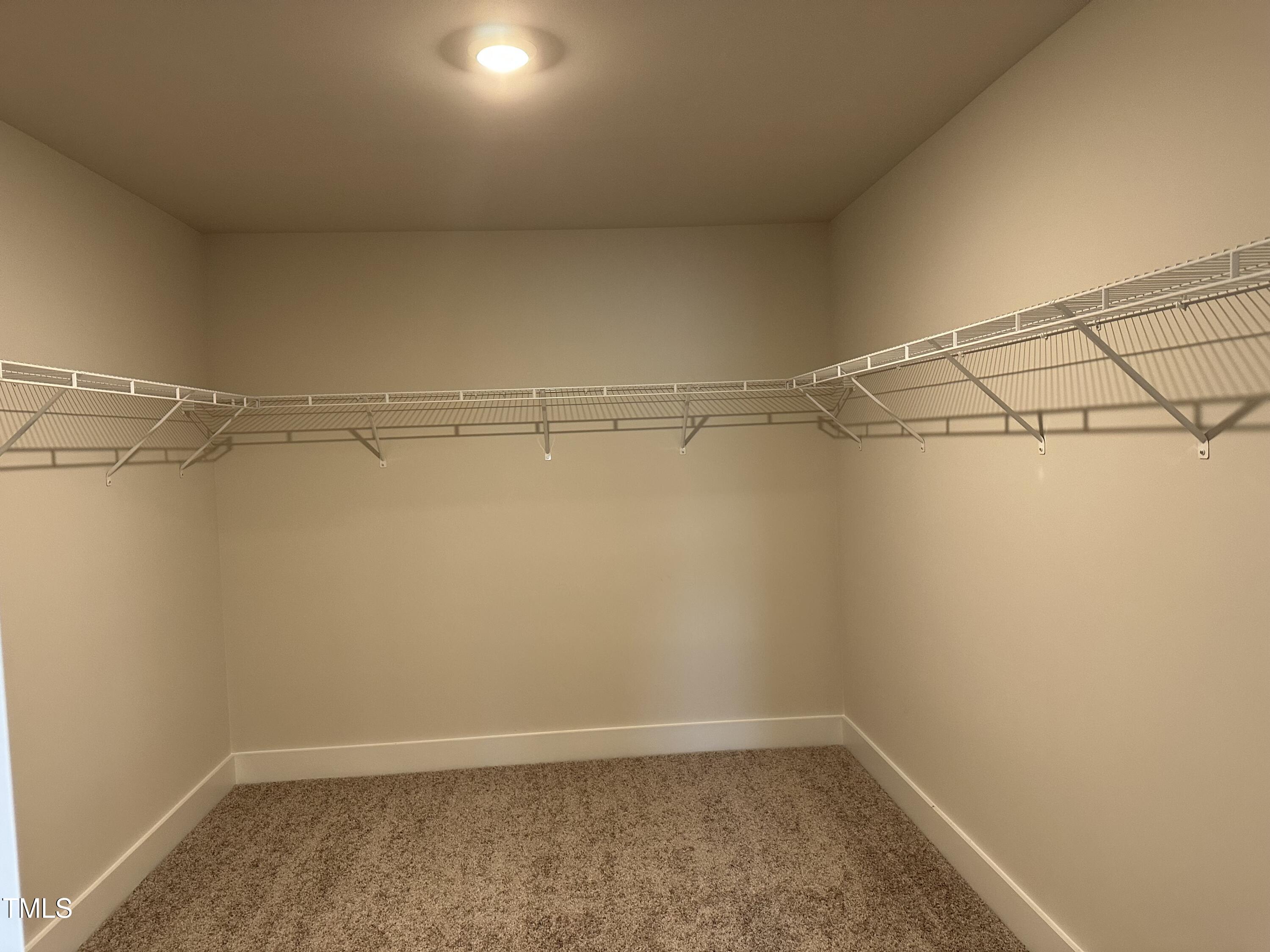 306 Shiloh Way Mebane, NC 27302 - Photo 16 of 33 a view of a room with racks on the wall