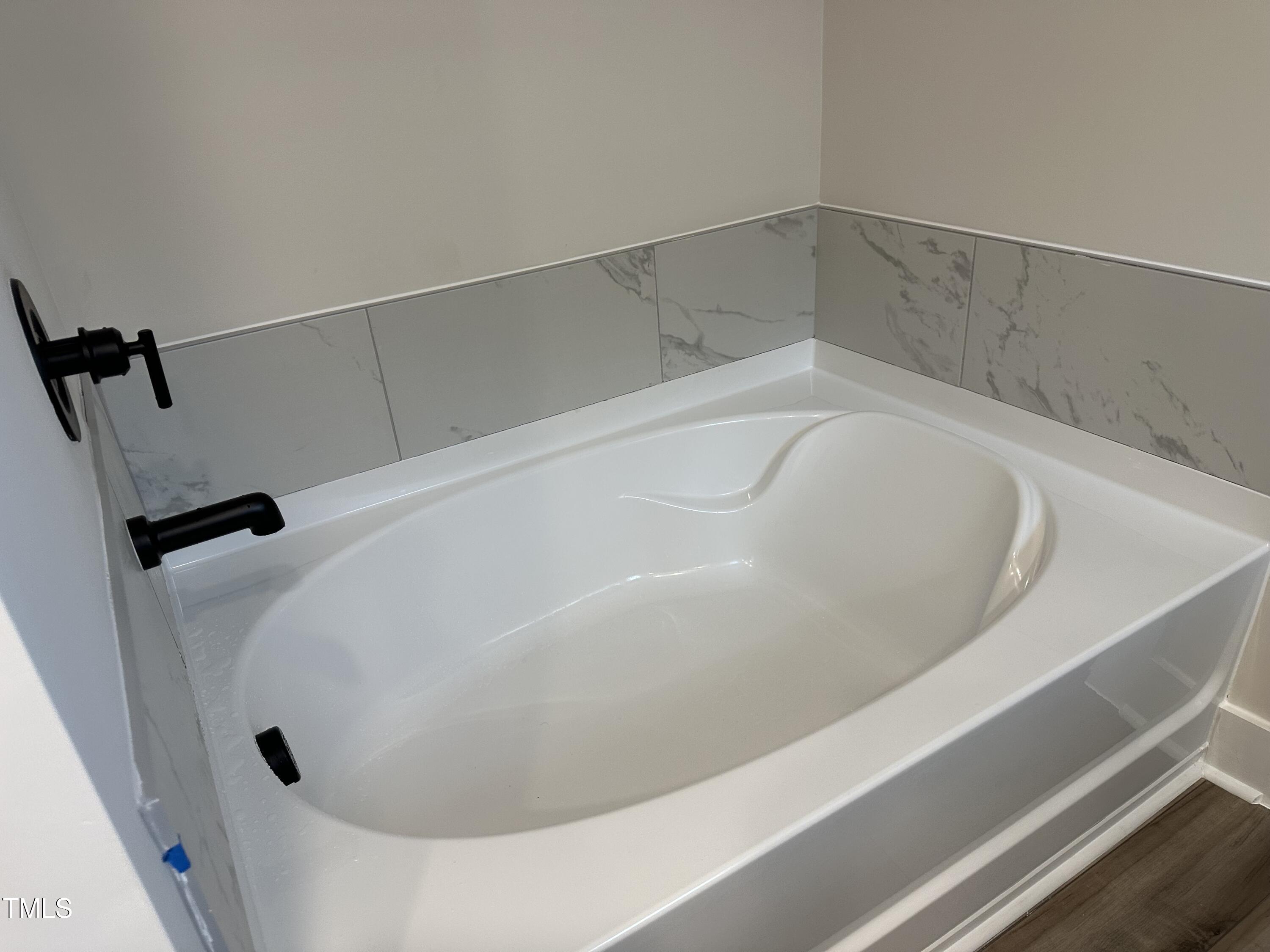 306 Shiloh Way Mebane, NC 27302 - Photo 20 of 33 a close view of a bathtub in bathroom