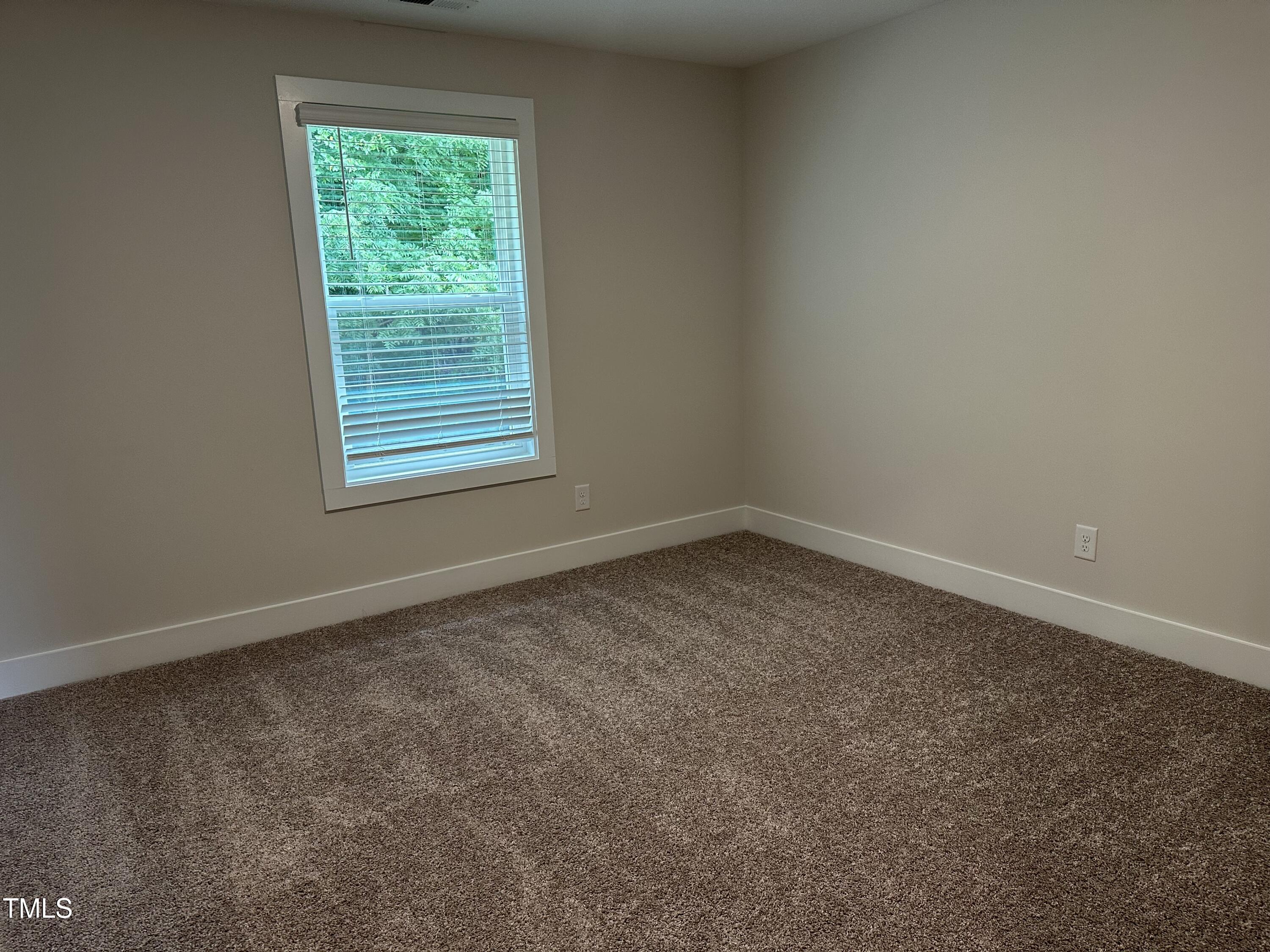 306 Shiloh Way Mebane, NC 27302 - Photo 21 of 33 an empty room with a window