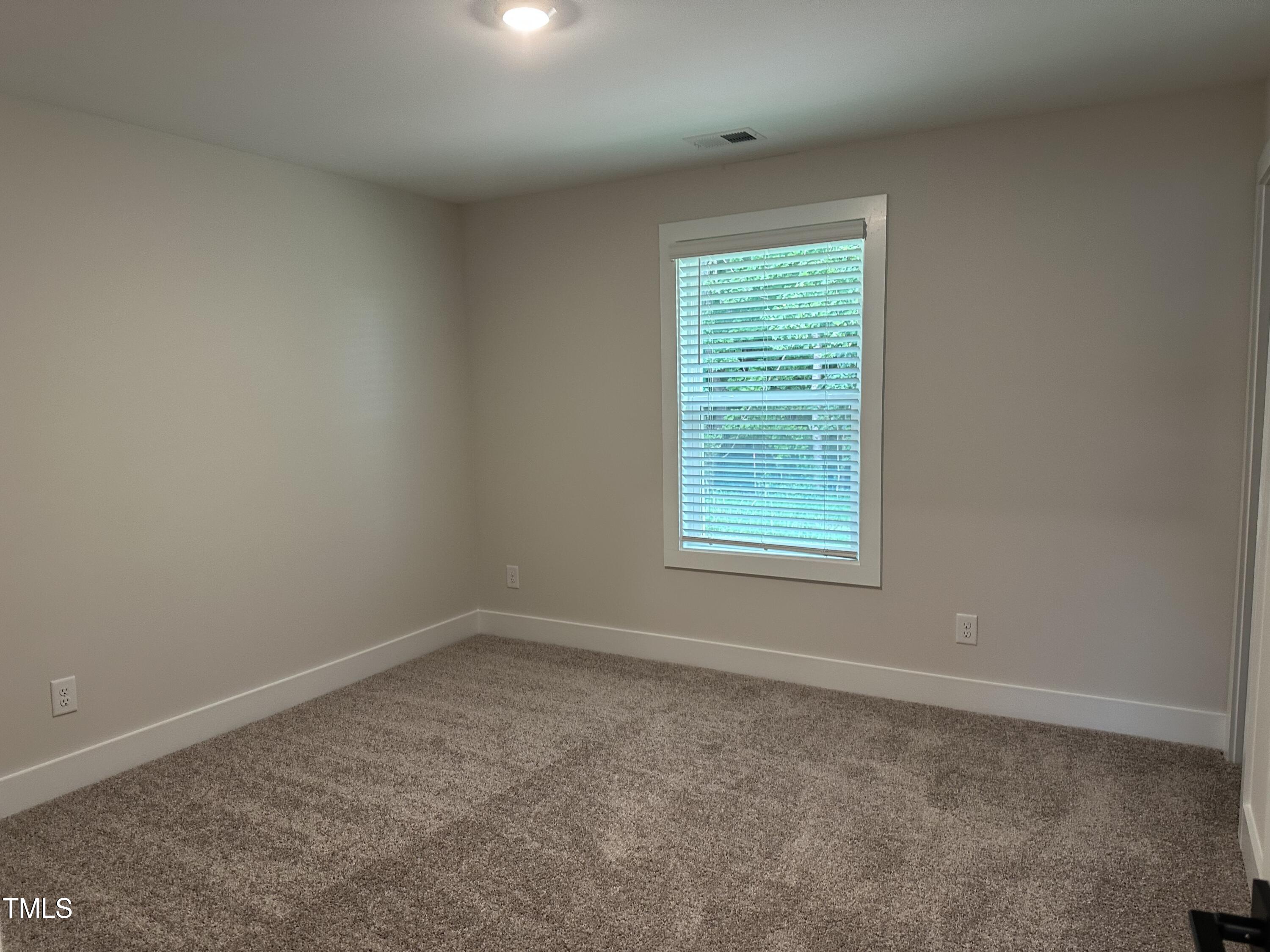 306 Shiloh Way Mebane, NC 27302 - Photo 24 of 33 an empty room with a window