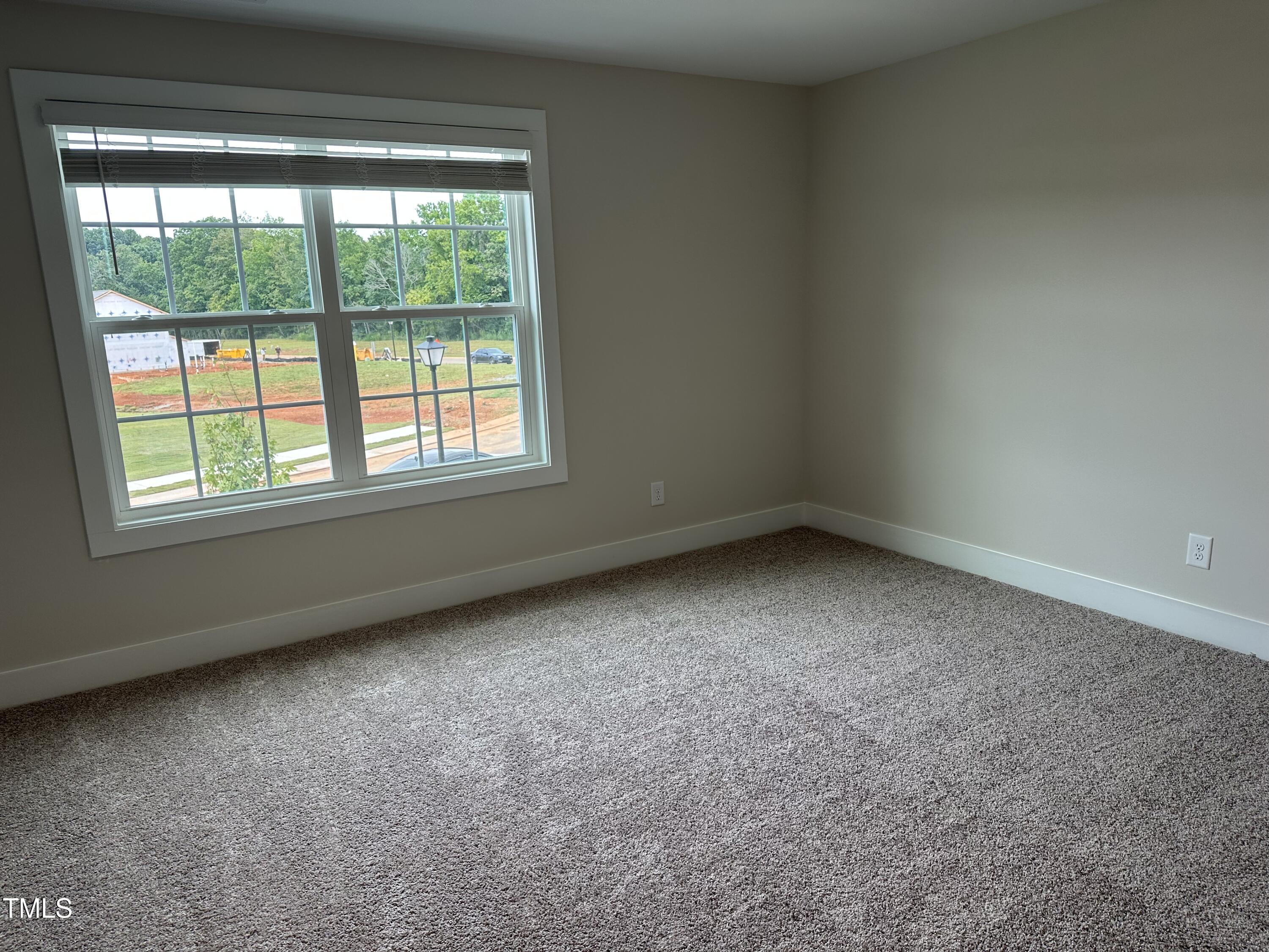 306 Shiloh Way Mebane, NC 27302 - Photo 27 of 33 an empty room with a window