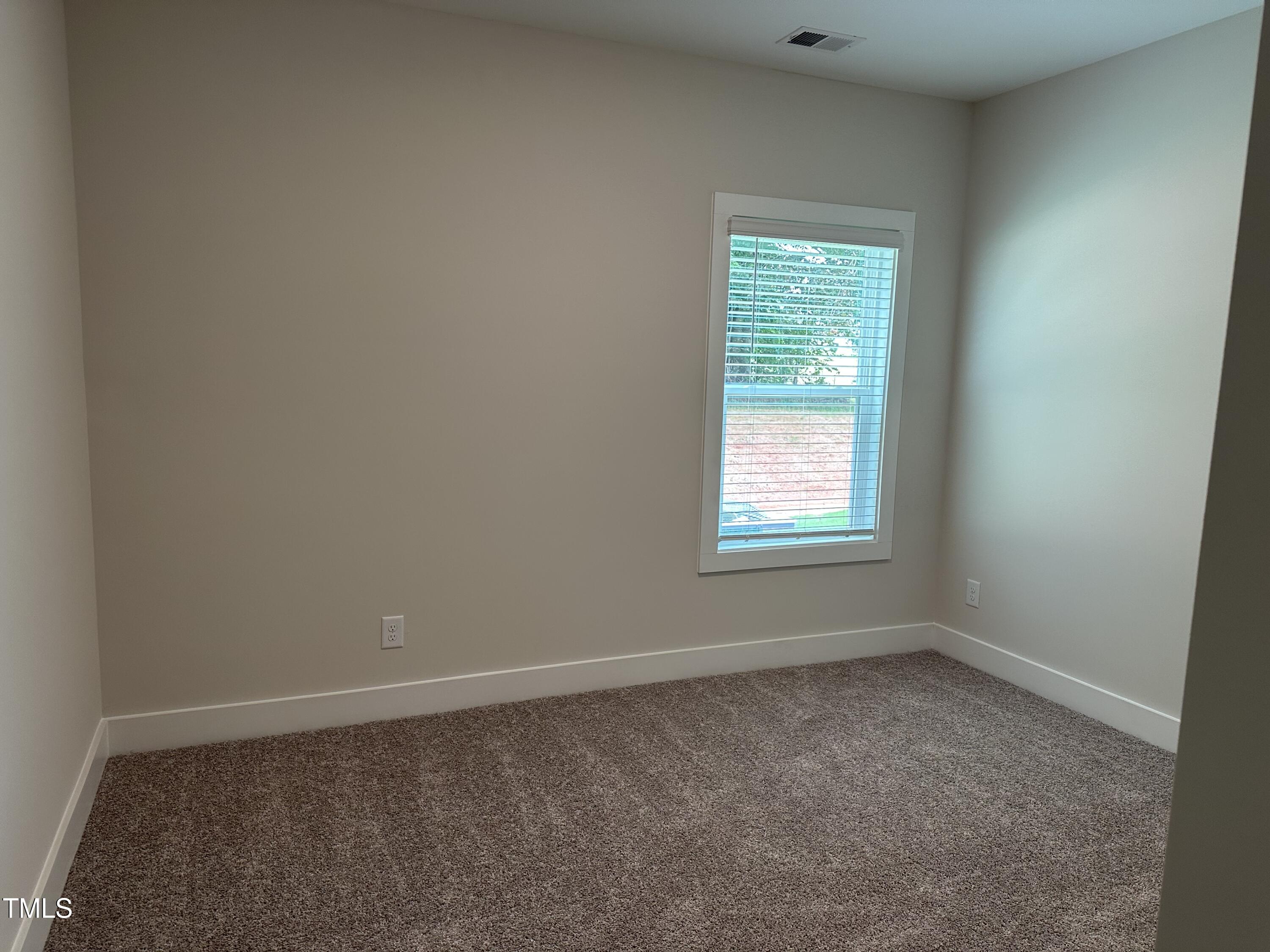 306 Shiloh Way Mebane, NC 27302 - Photo 3 of 33 an empty room with a window