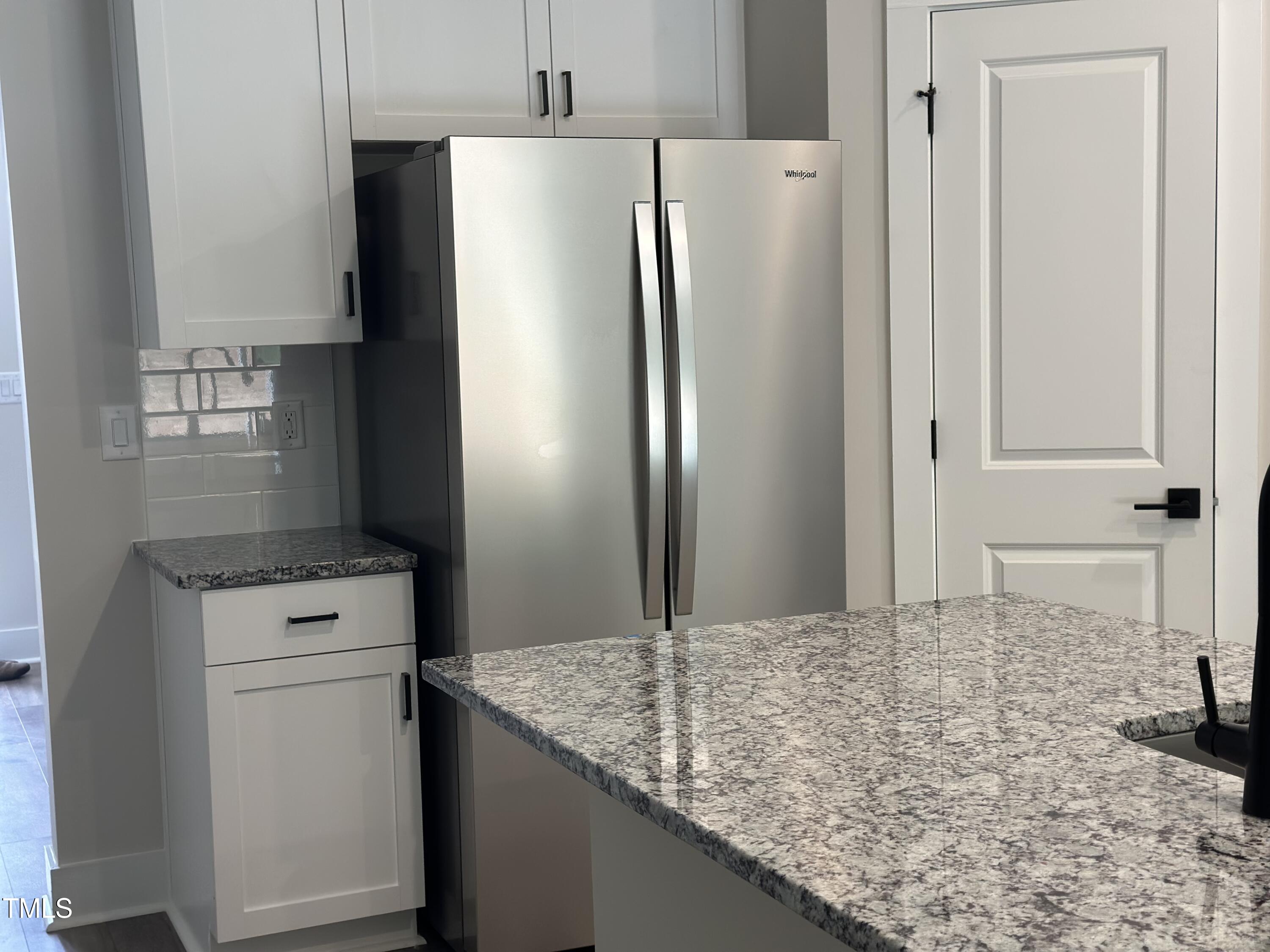 306 Shiloh Way Mebane, NC 27302 - Photo 9 of 33 a kitchen with a refrigerator and a sink