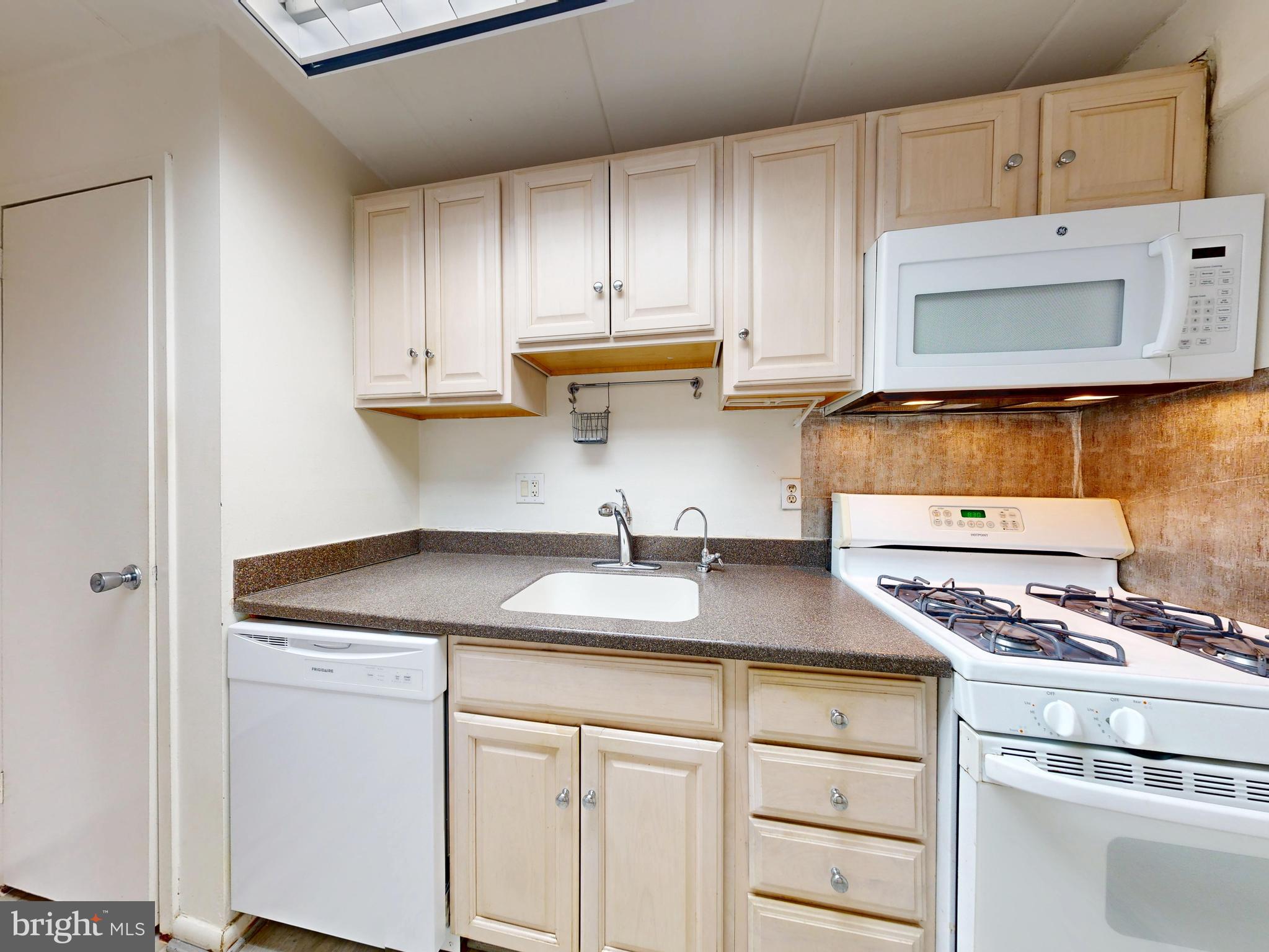 2629 Fort Farnsworth Road, Unit 276 Alexandria, VA 22303 - Photo 17 of 37 a kitchen with stainless steel appliances granite countertop a sink and cabinets