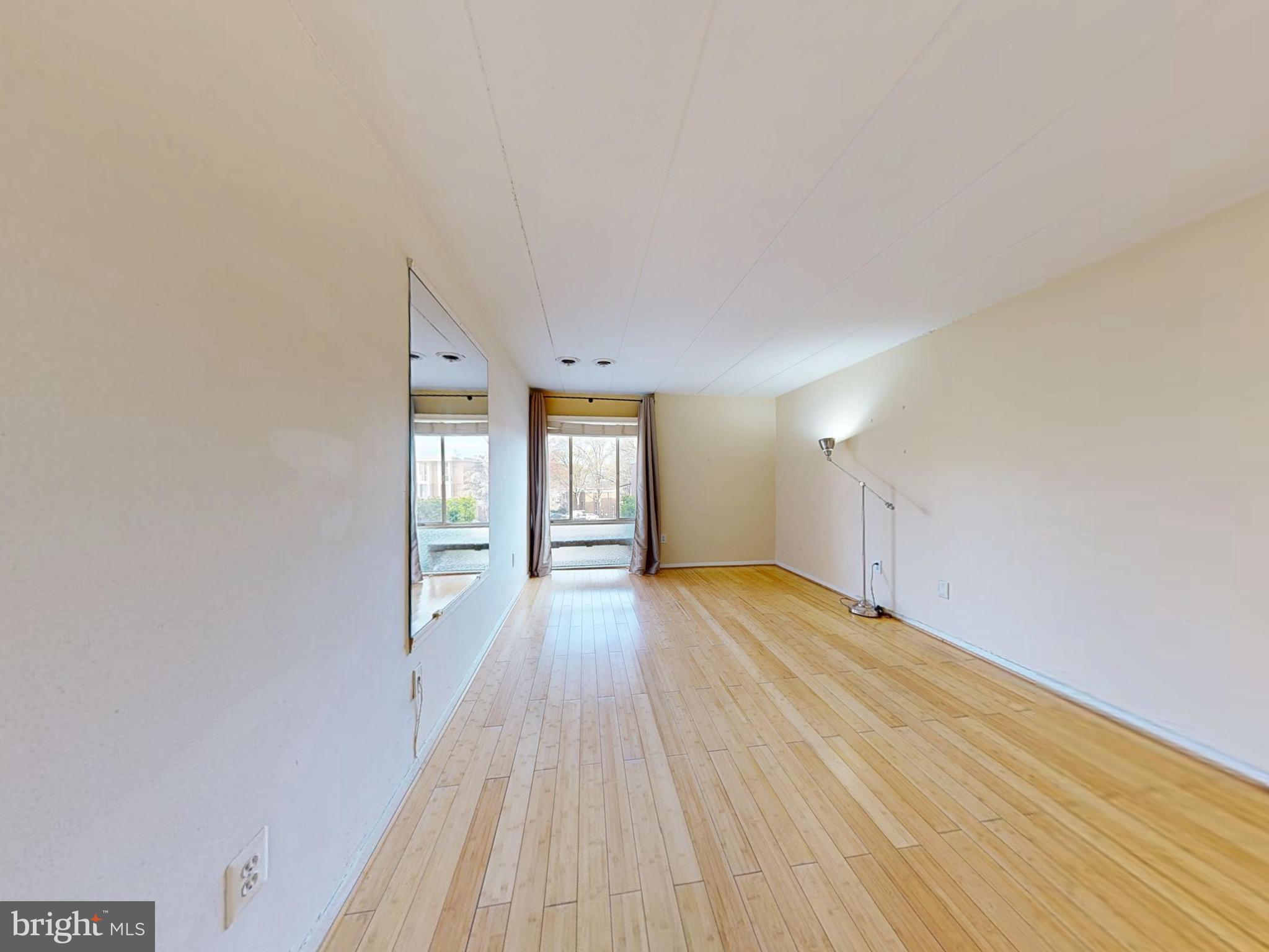 2629 Fort Farnsworth Road, Unit 276 Alexandria, VA 22303 - Photo 18 of 37 a view of an empty room with wooden floor