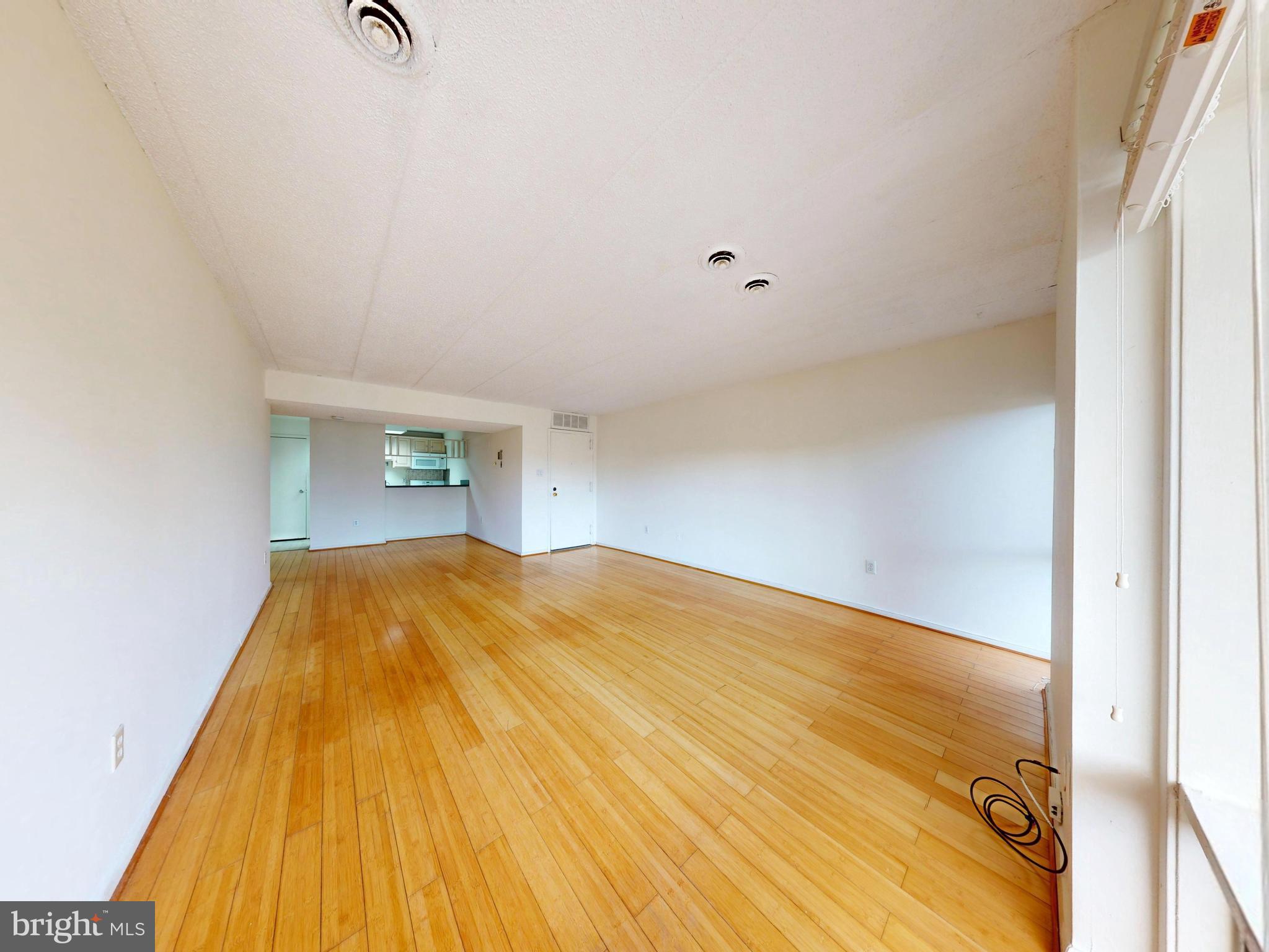 2629 Fort Farnsworth Road, Unit 276 Alexandria, VA 22303 - Photo 19 of 37 a bedroom with a bed and a table
